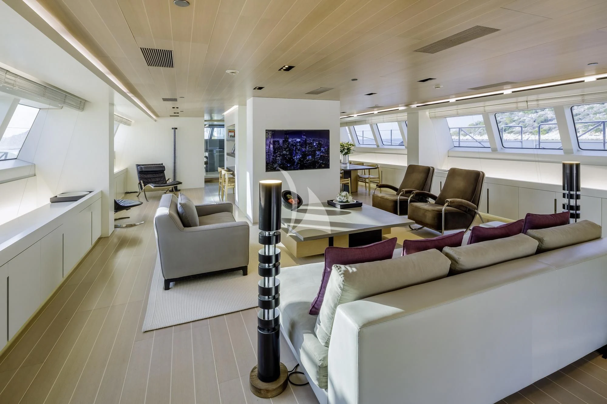 a living room with a large tv aboard BARACUDA VALLETTA Yacht for Sale