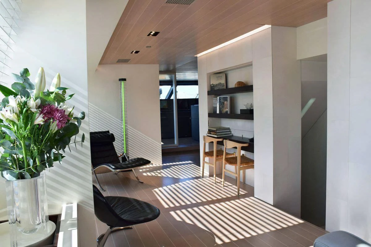 a room with a table and chairs aboard BARACUDA VALLETTA Yacht for Sale