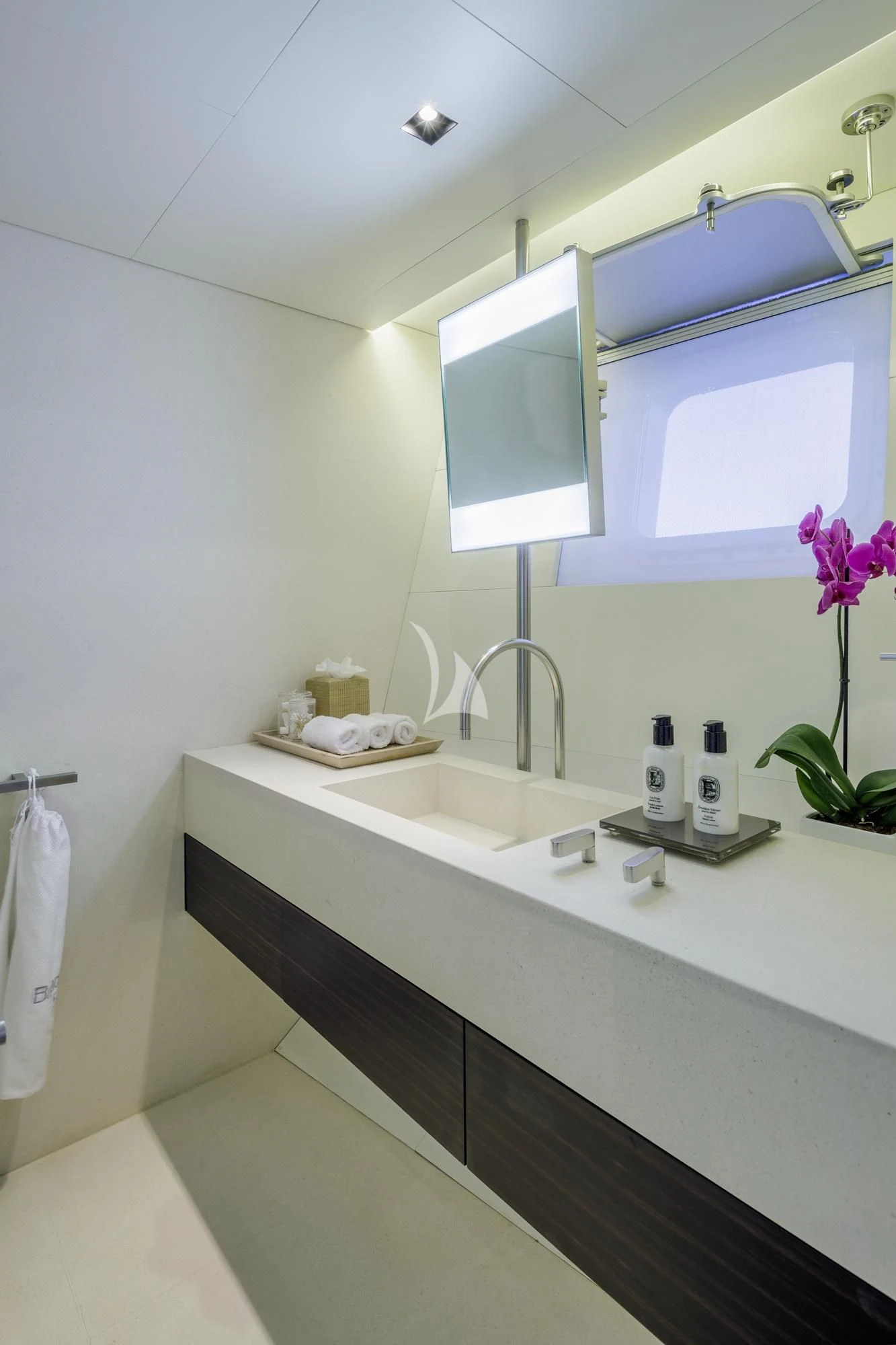 a bathroom with a sink and a mirror aboard BARACUDA VALLETTA Yacht for Sale