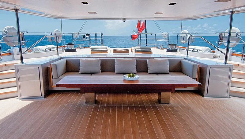 a couch and a table on a boat aboard BARACUDA VALLETTA Yacht for Sale