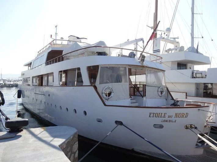 a white boat in a harbor aboard ETOILE DU NORD Yacht for Sale
