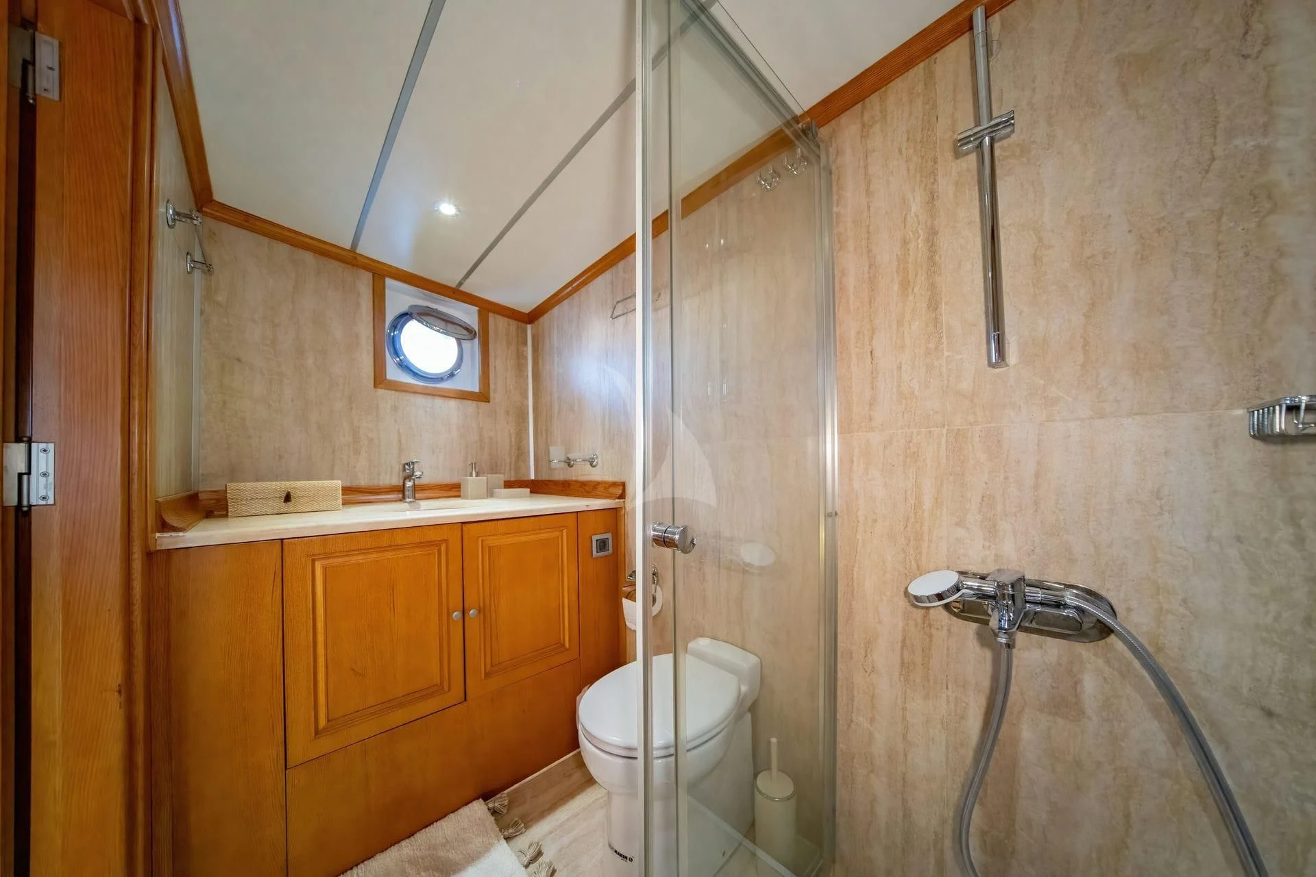 a bathroom with a shower and toilet aboard BABYLON Yacht for Sale