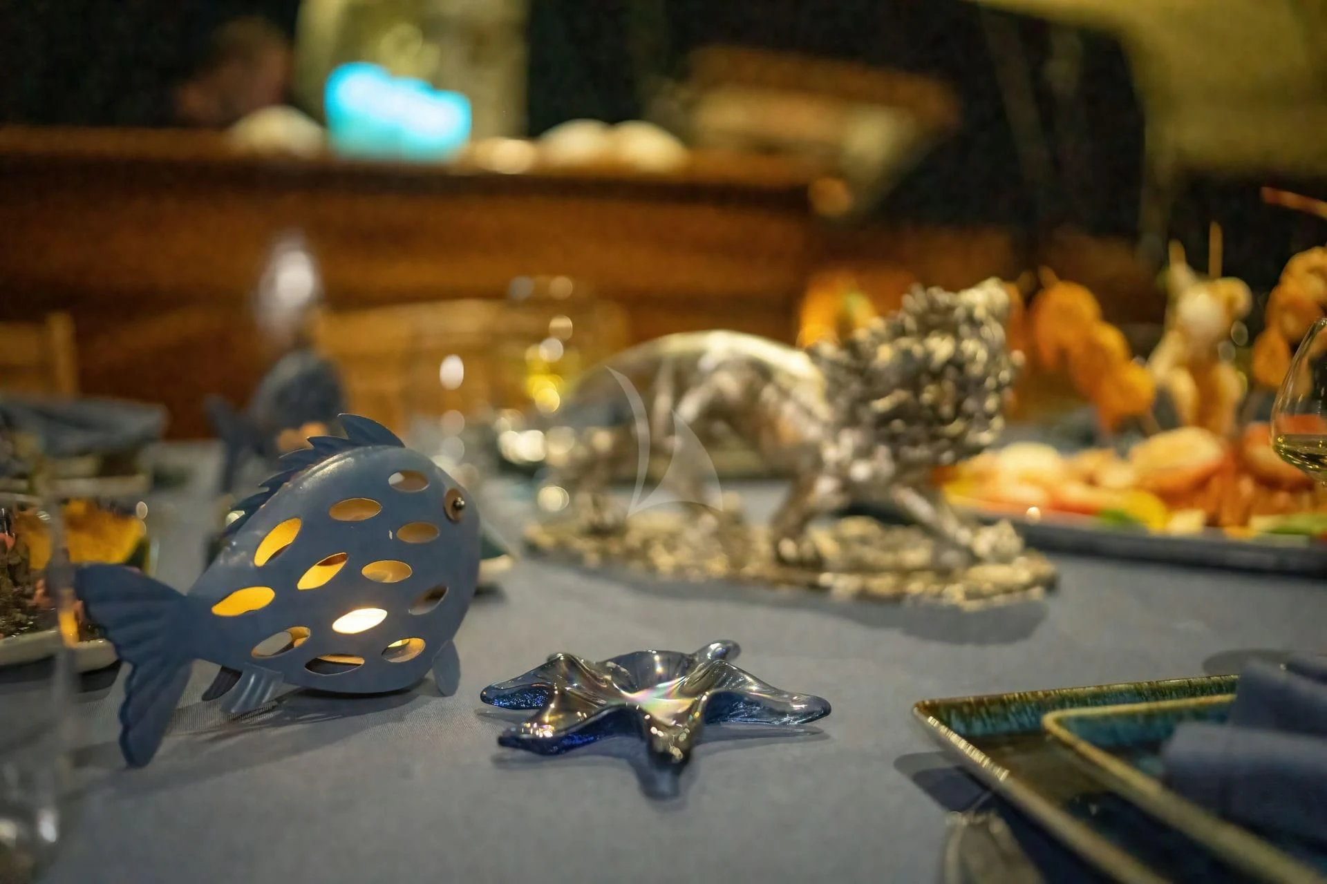 a group of butterflies on a table aboard BABYLON Yacht for Sale