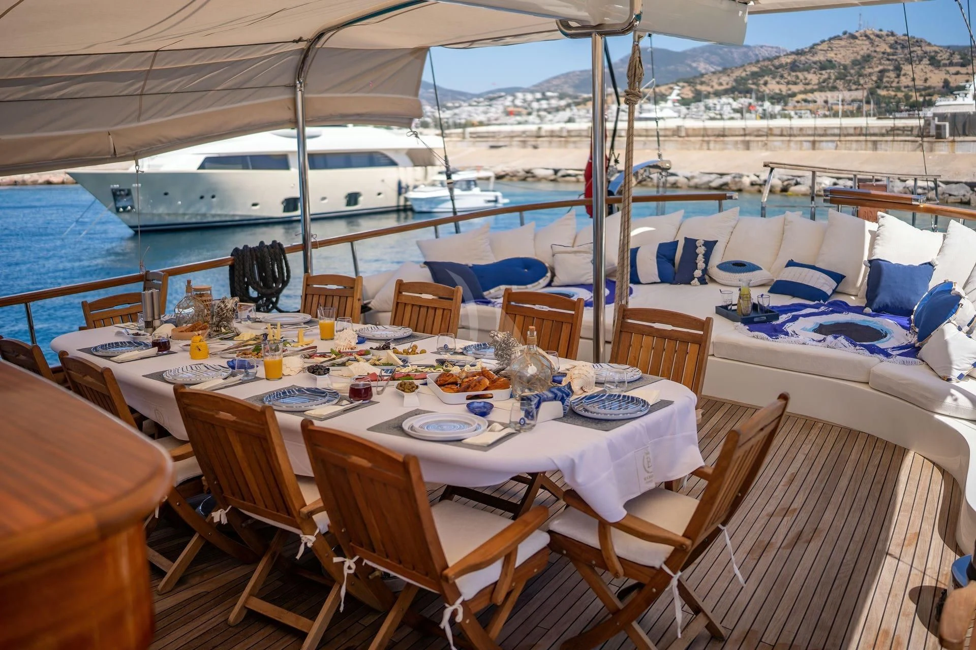 a table set for a meal on a boat aboard BABYLON Yacht for Sale