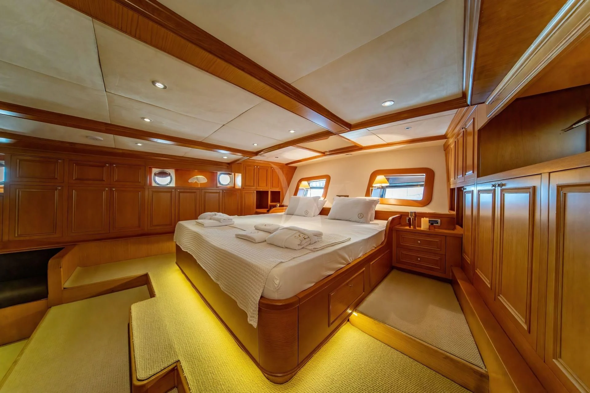 a room with a bed and a desk aboard BABYLON Yacht for Sale