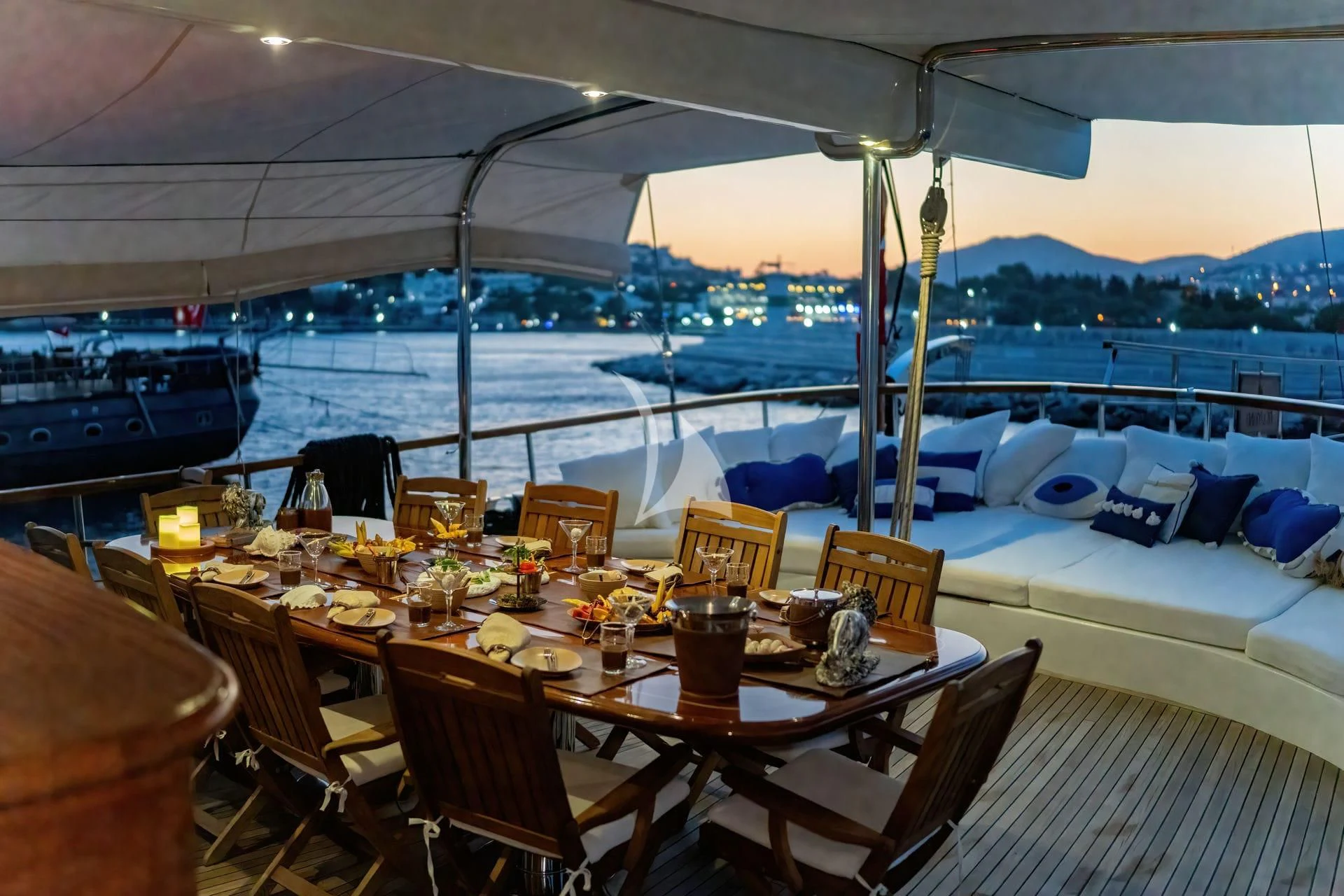 a table set for a meal on a boat aboard BABYLON Yacht for Sale