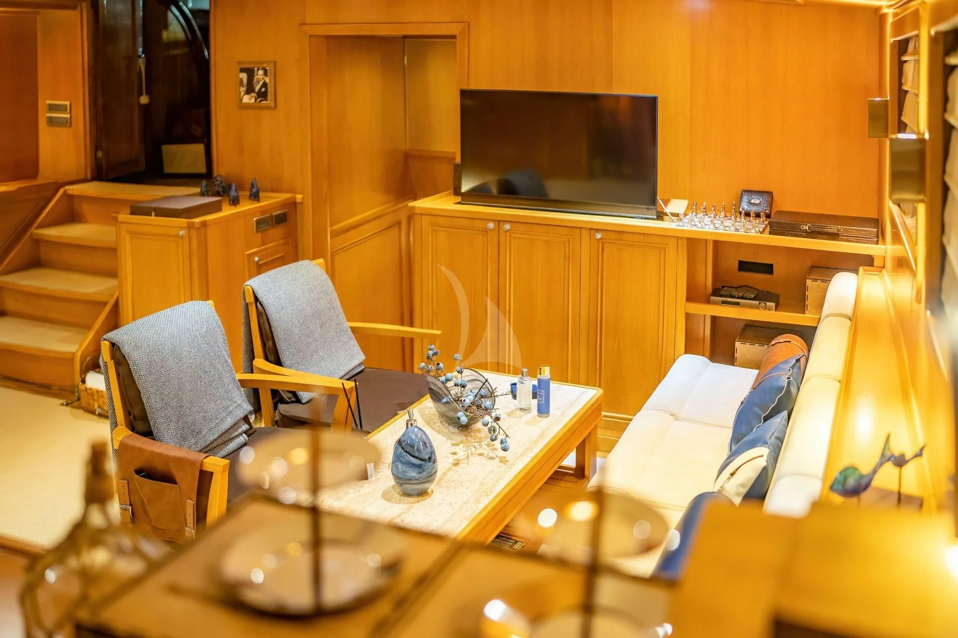 a room with a table and chairs aboard BABYLON Yacht for Sale