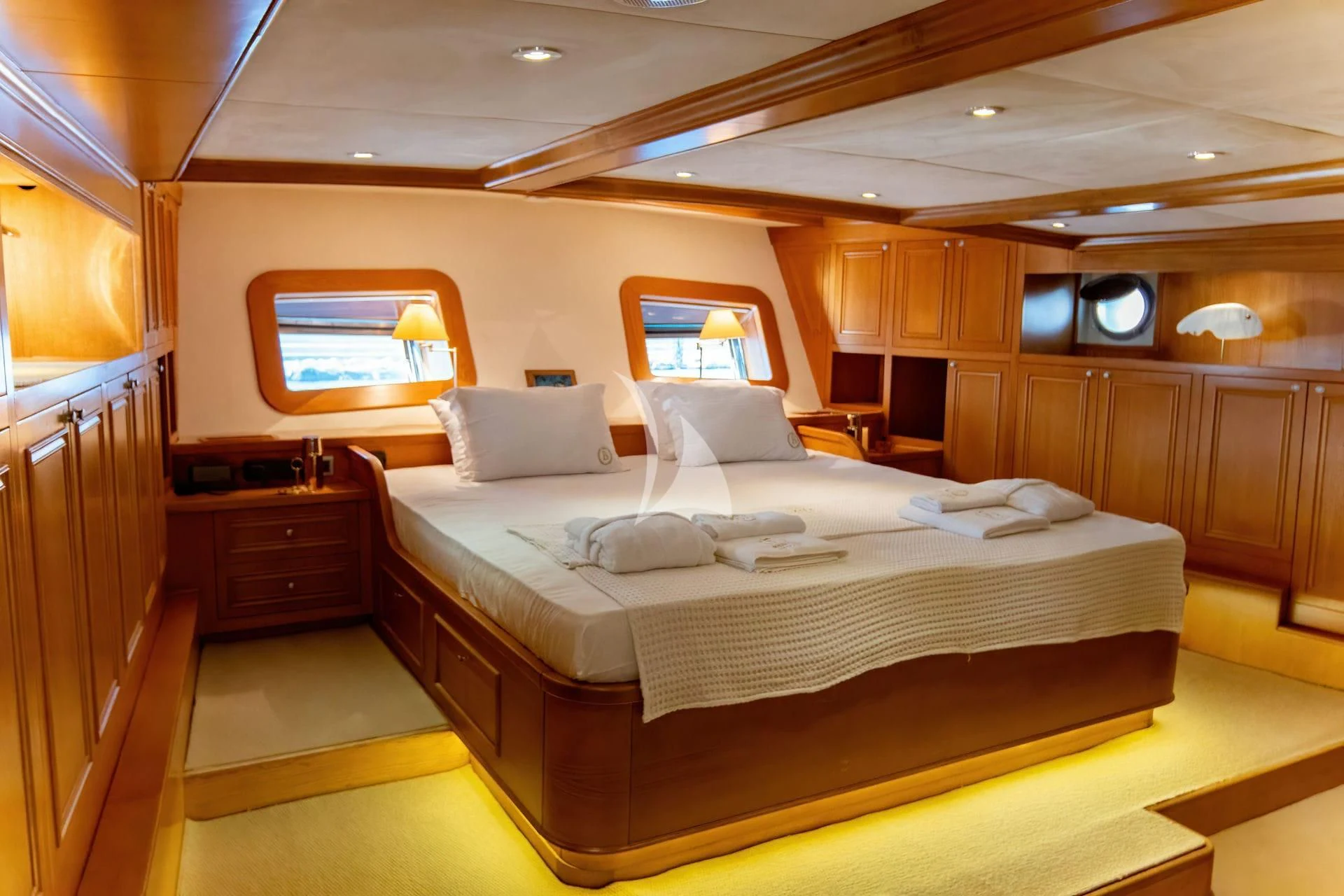 a room with a bed and a window aboard BABYLON Yacht for Sale