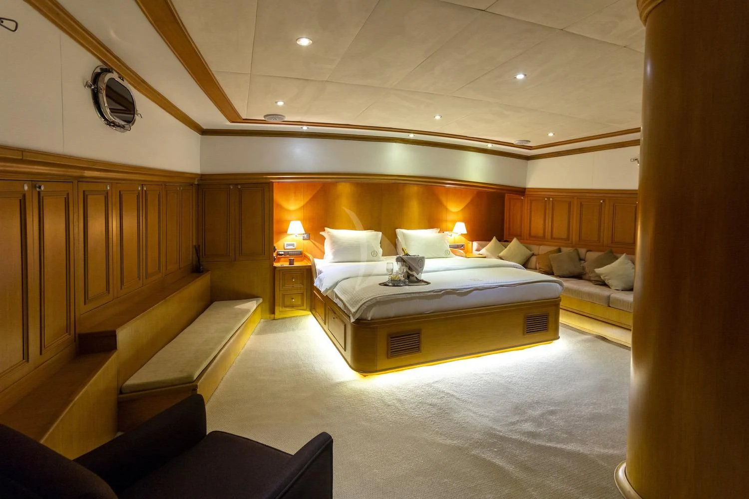 a room with a bed and a couch aboard BABYLON Yacht for Sale