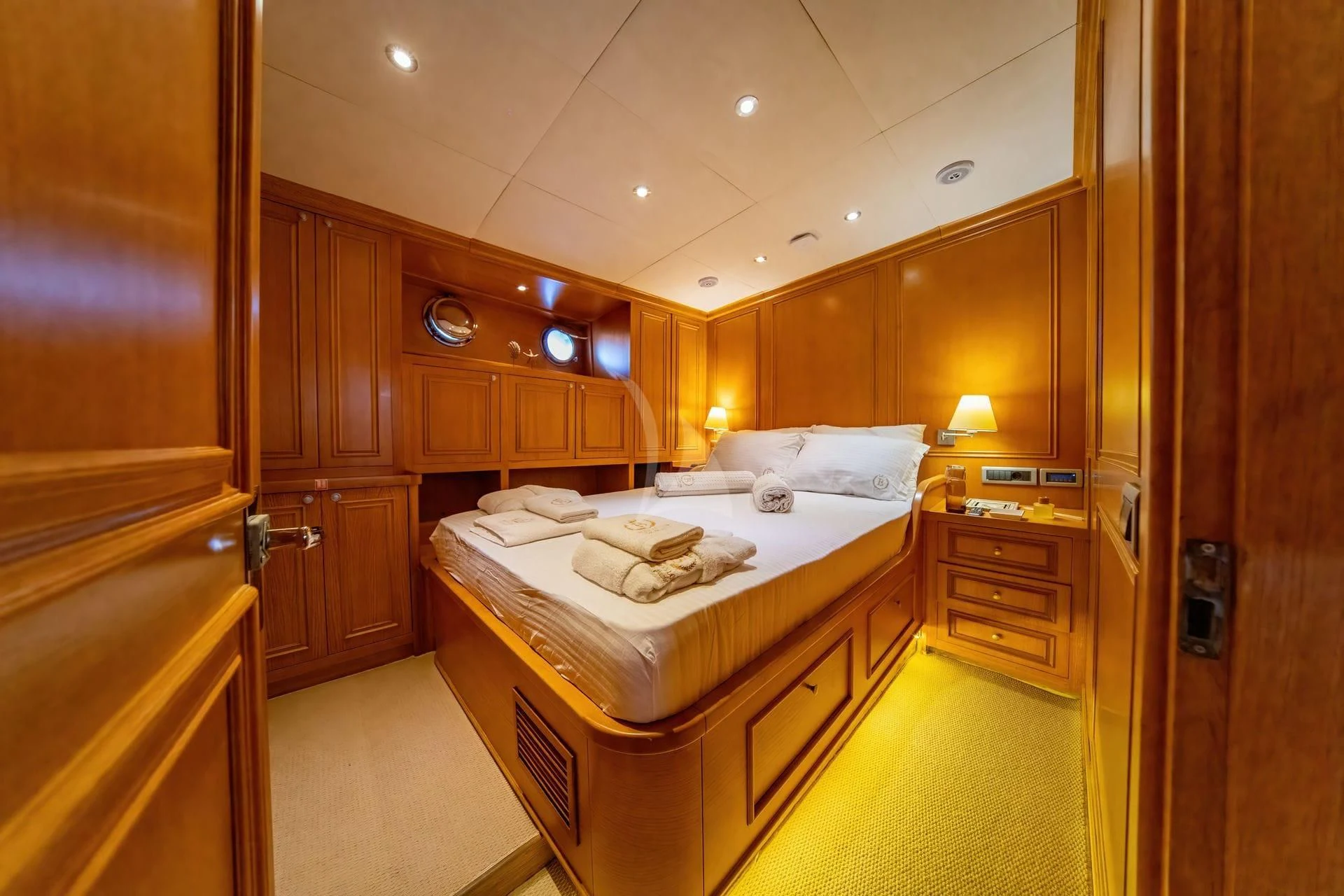 a large bathroom with a large bed aboard BABYLON Yacht for Sale