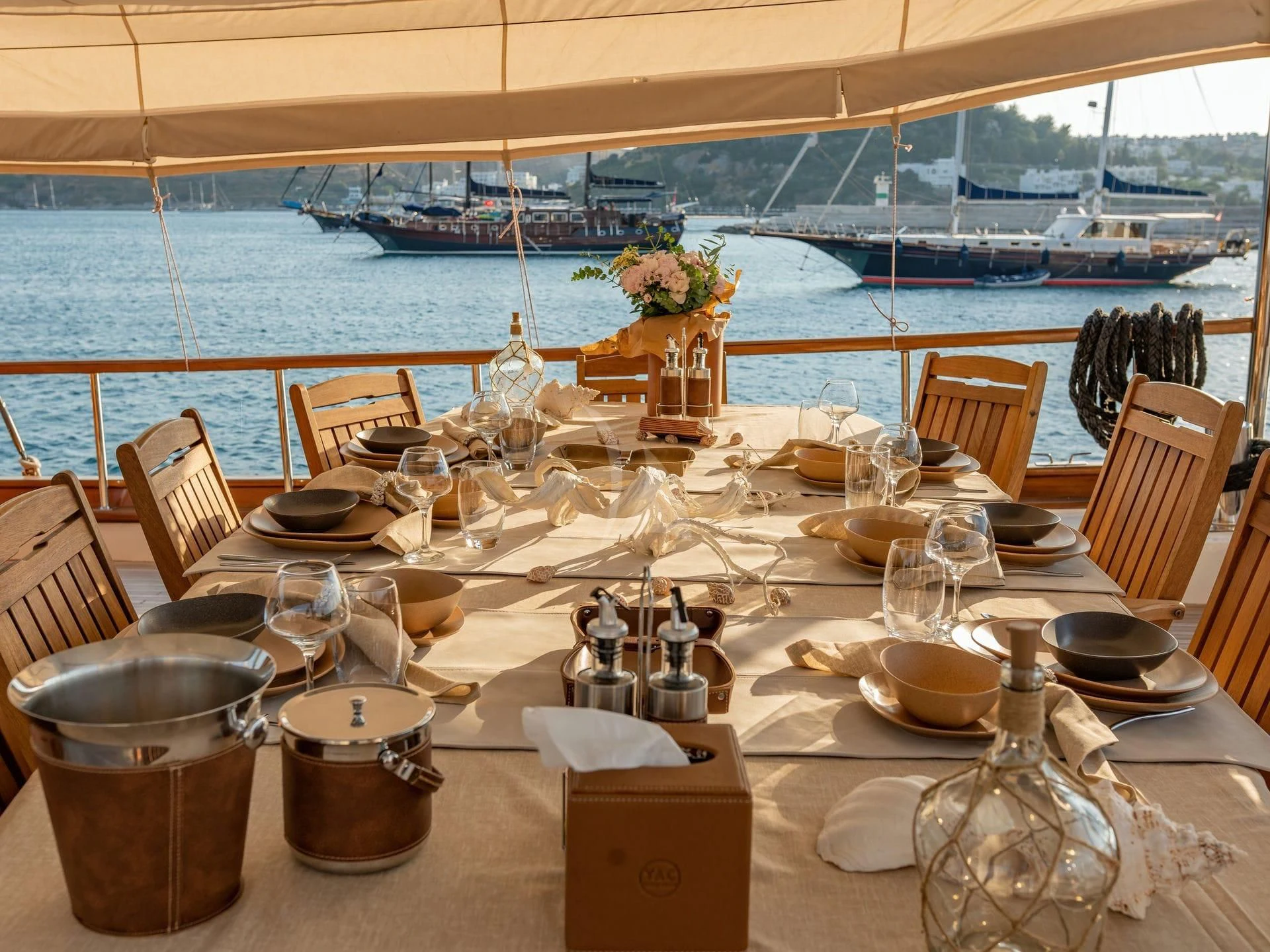 a table with food and drinks on it aboard BABYLON Yacht for Sale
