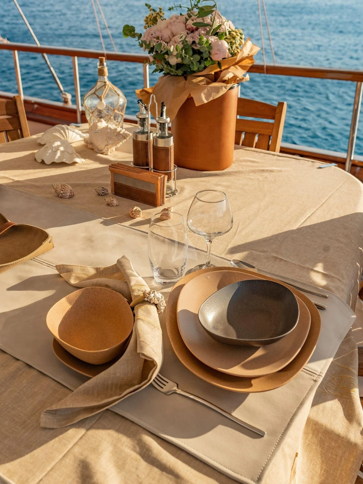 a table with a set of dishes on it aboard BABYLON Yacht for Sale