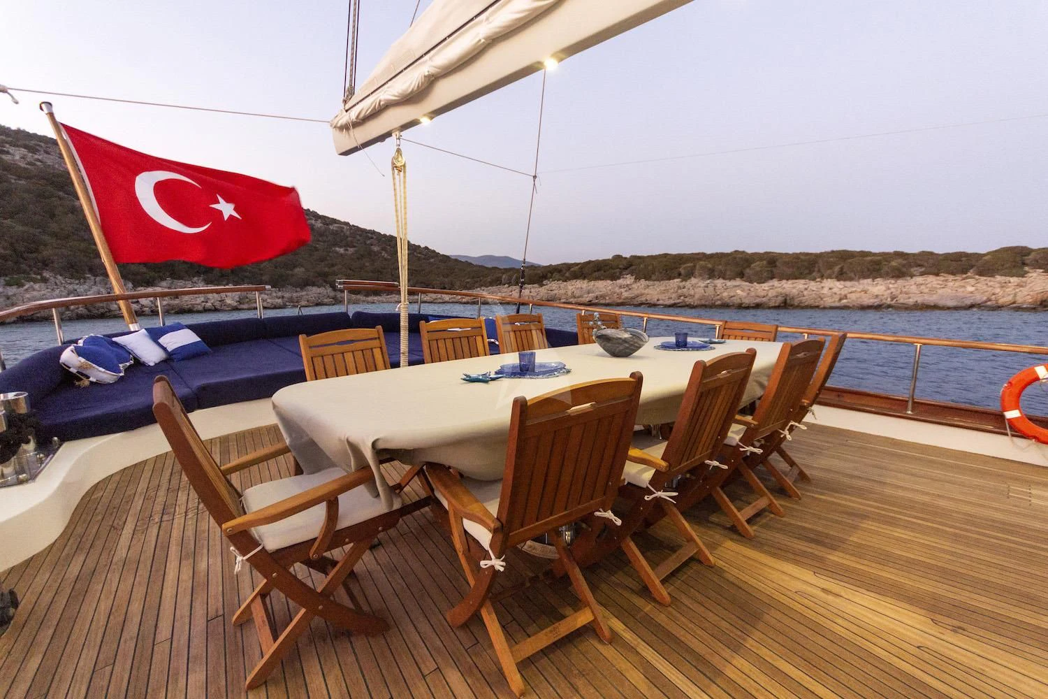 chairs and umbrella on a deck aboard BABYLON Yacht for Sale