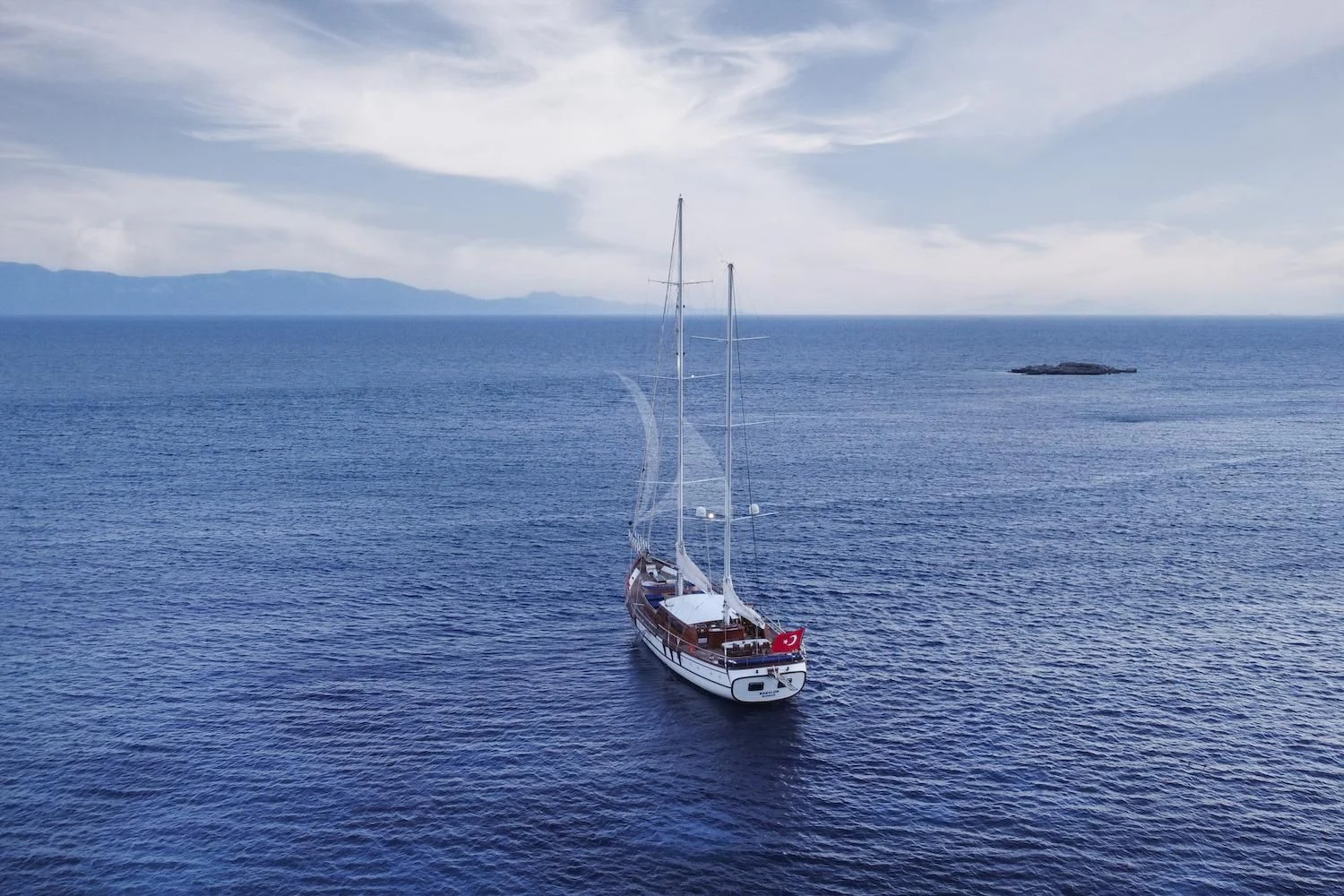 a boat sailing in the sea aboard BABYLON Yacht for Sale