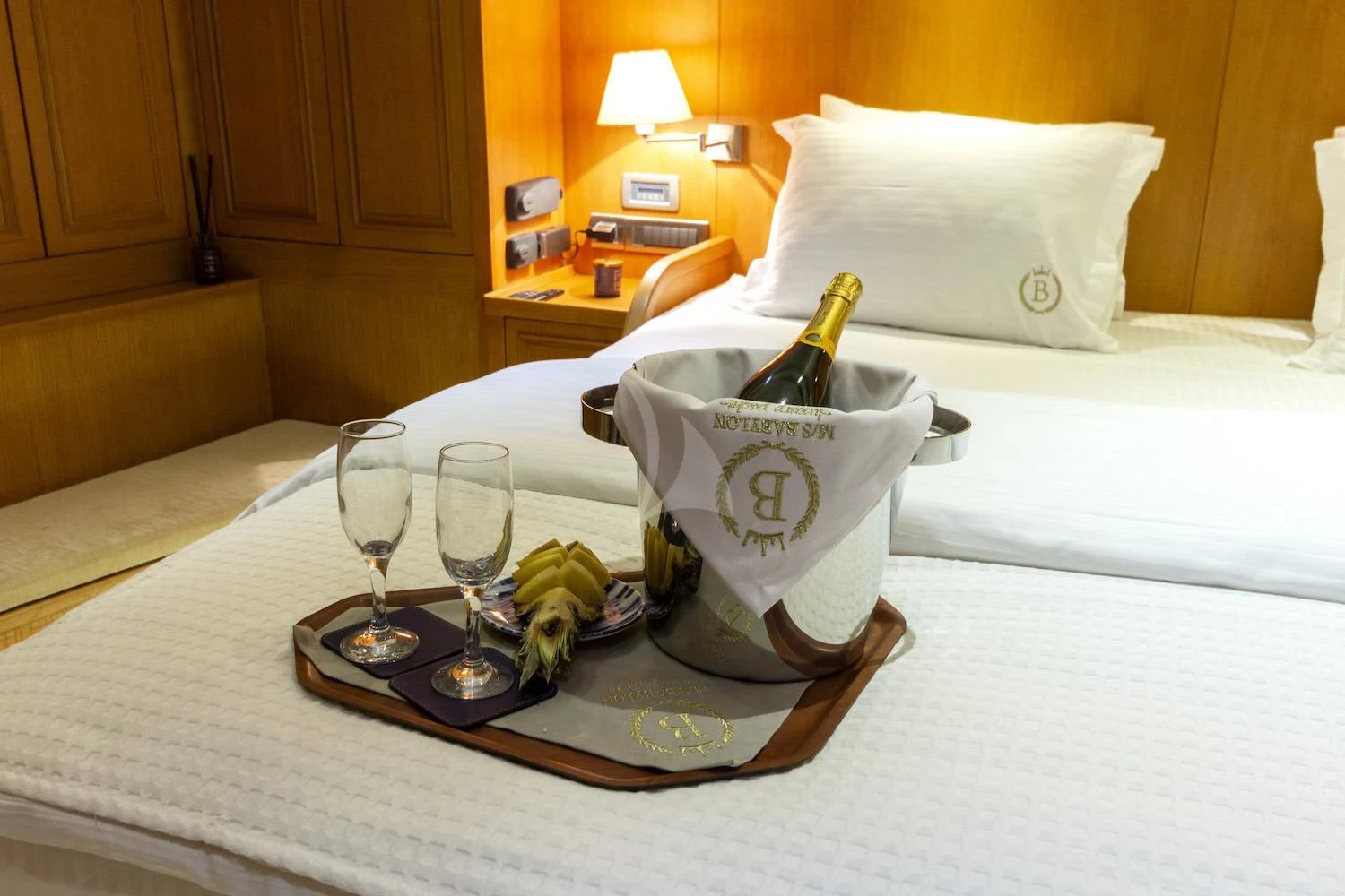 a bottle of wine on a tray aboard BABYLON Yacht for Sale