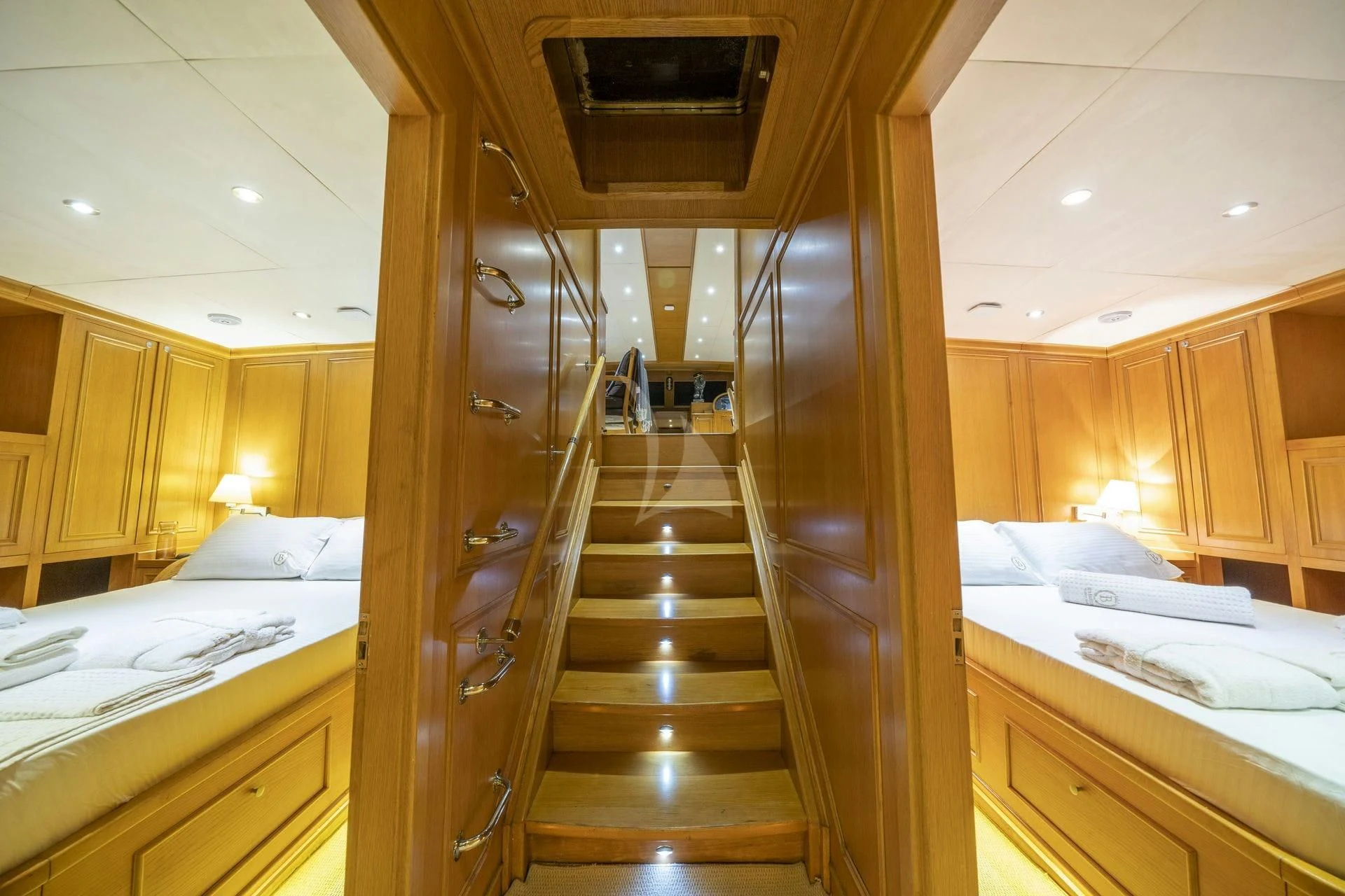 a wooden staircase in a room aboard BABYLON Yacht for Sale
