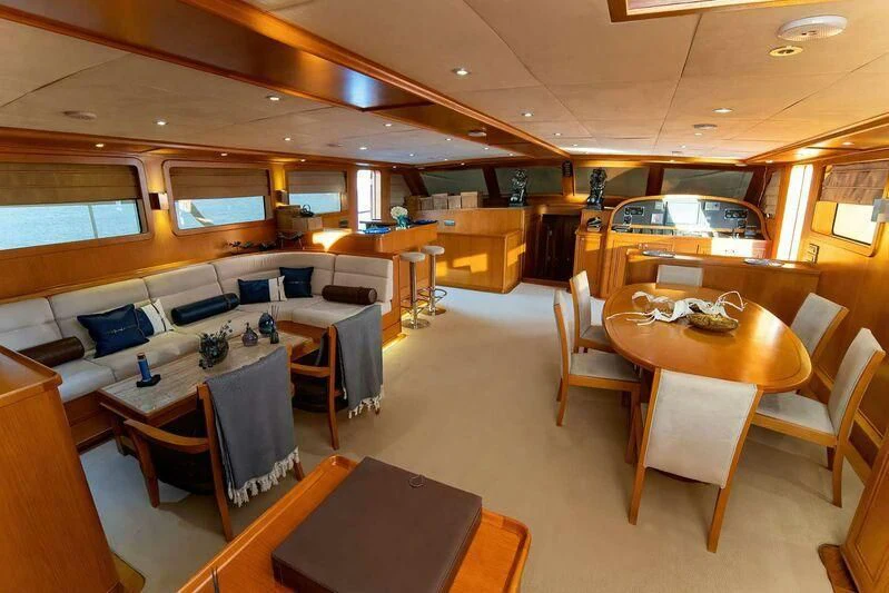 a room with tables and chairs aboard BABYLON Yacht for Sale