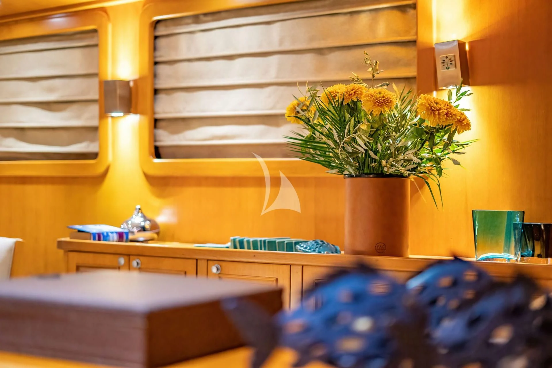 a plant in a pot on a table aboard BABYLON Yacht for Sale