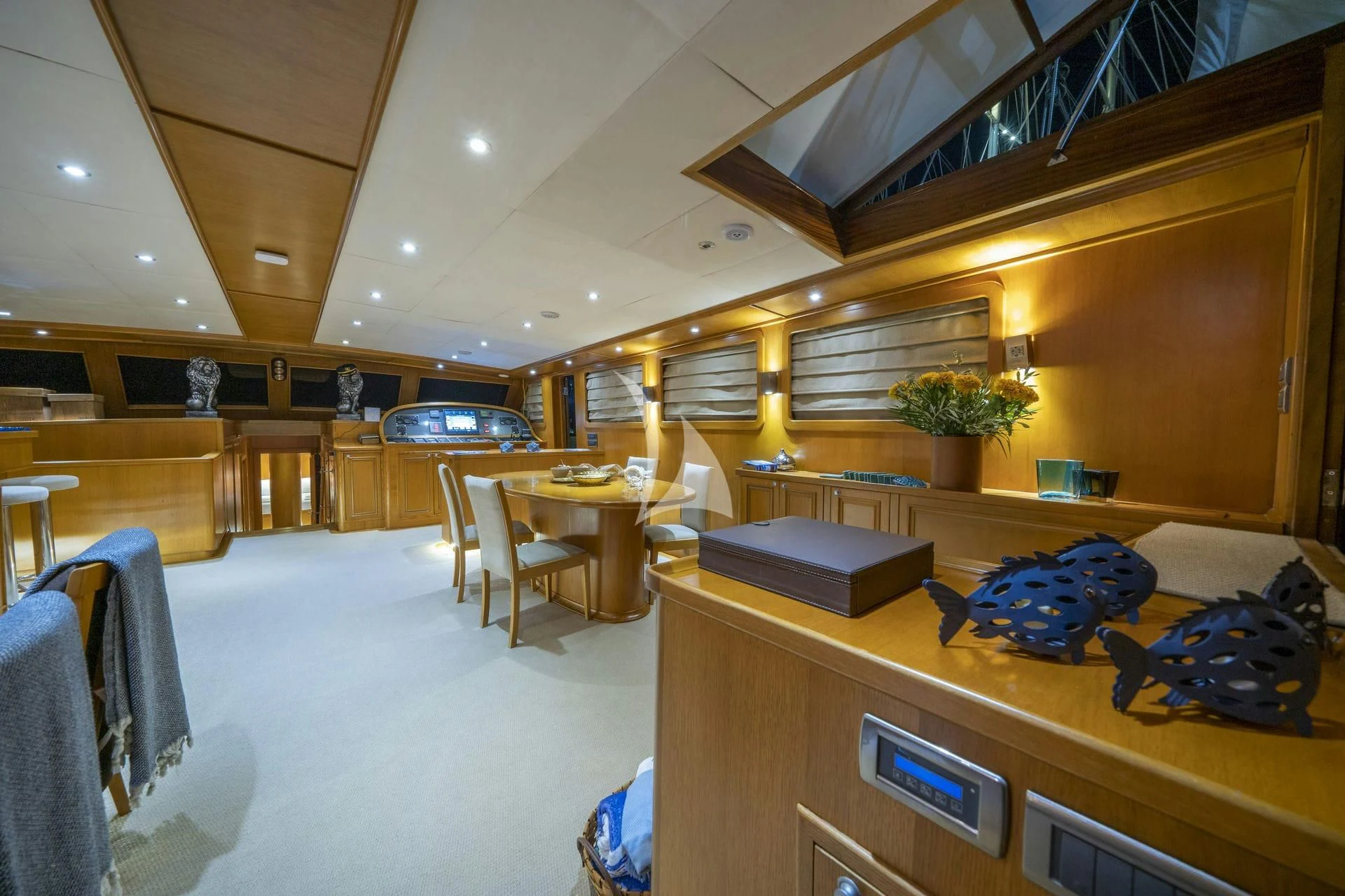 a room with a table and chairs aboard BABYLON Yacht for Sale