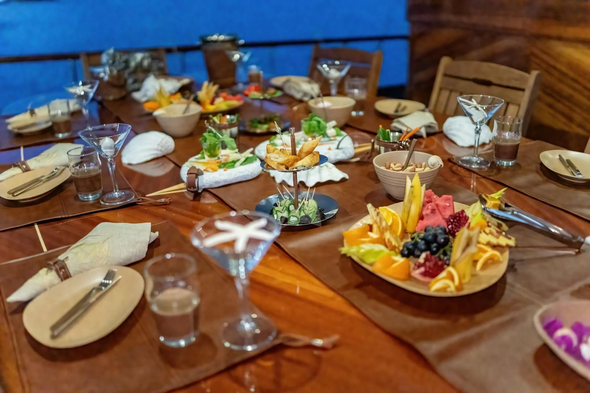 a table with food and glasses on it aboard BABYLON Yacht for Sale