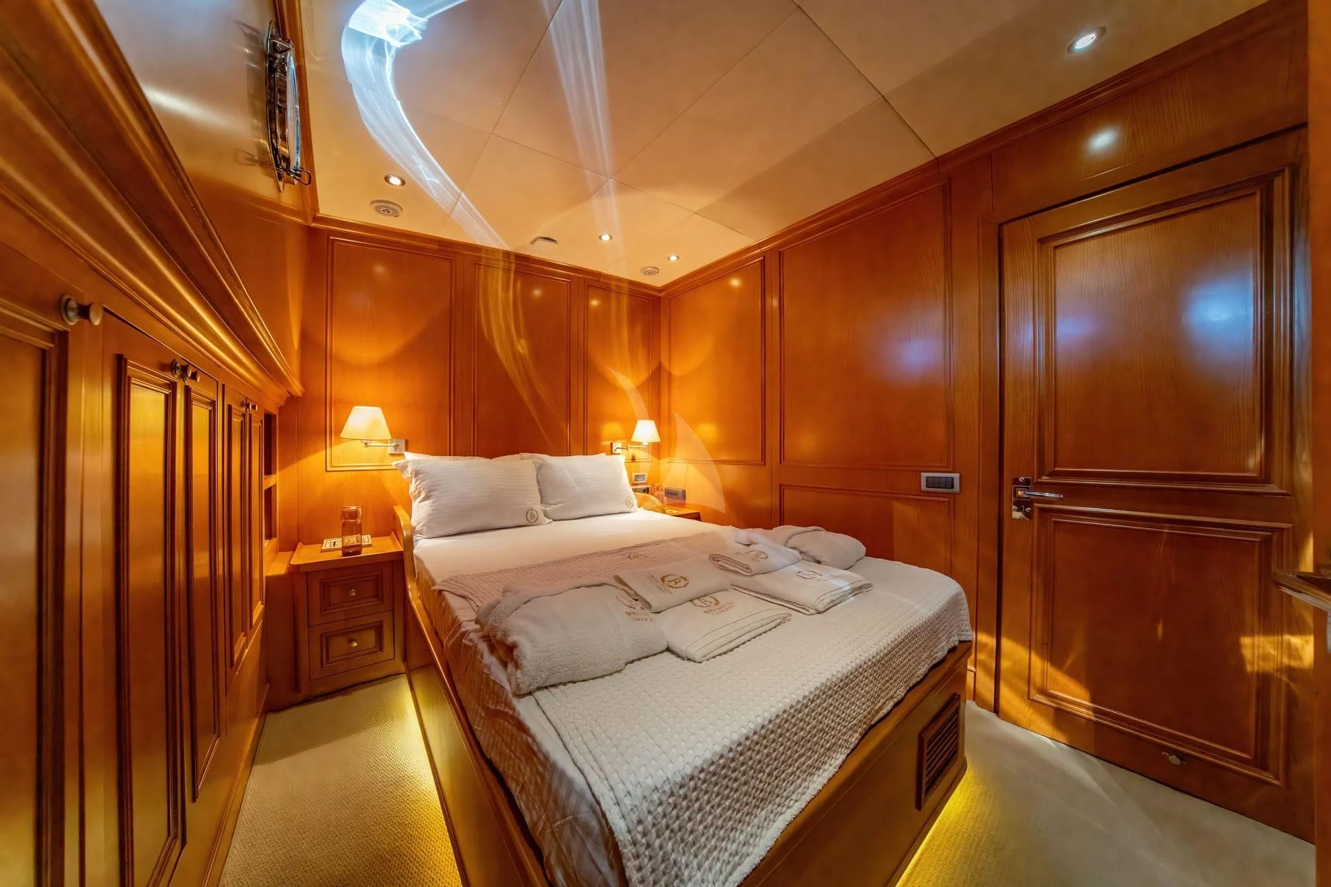 a hotel room with a bed aboard BABYLON Yacht for Sale