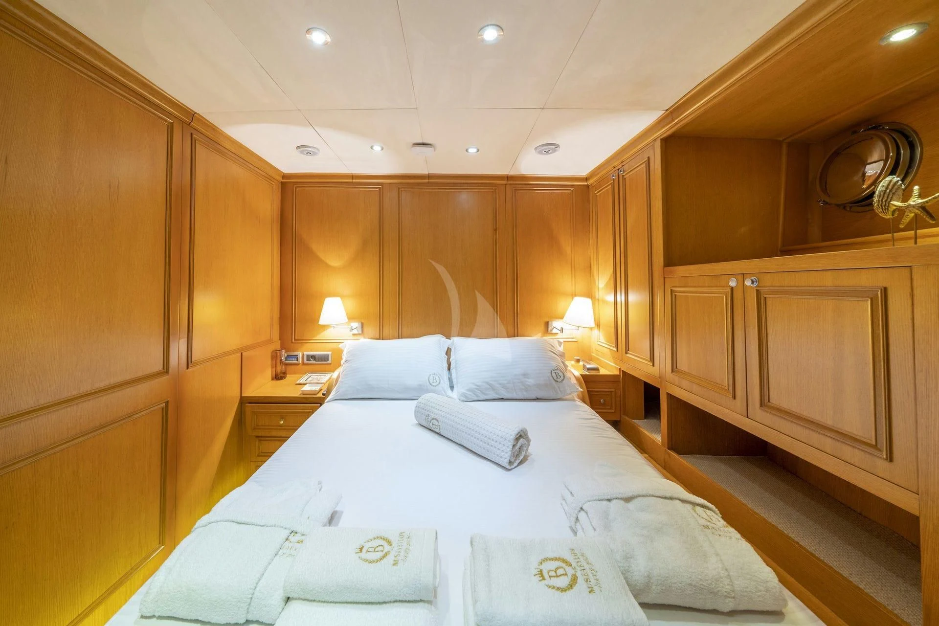 a room with a bed and a mirror aboard BABYLON Yacht for Sale