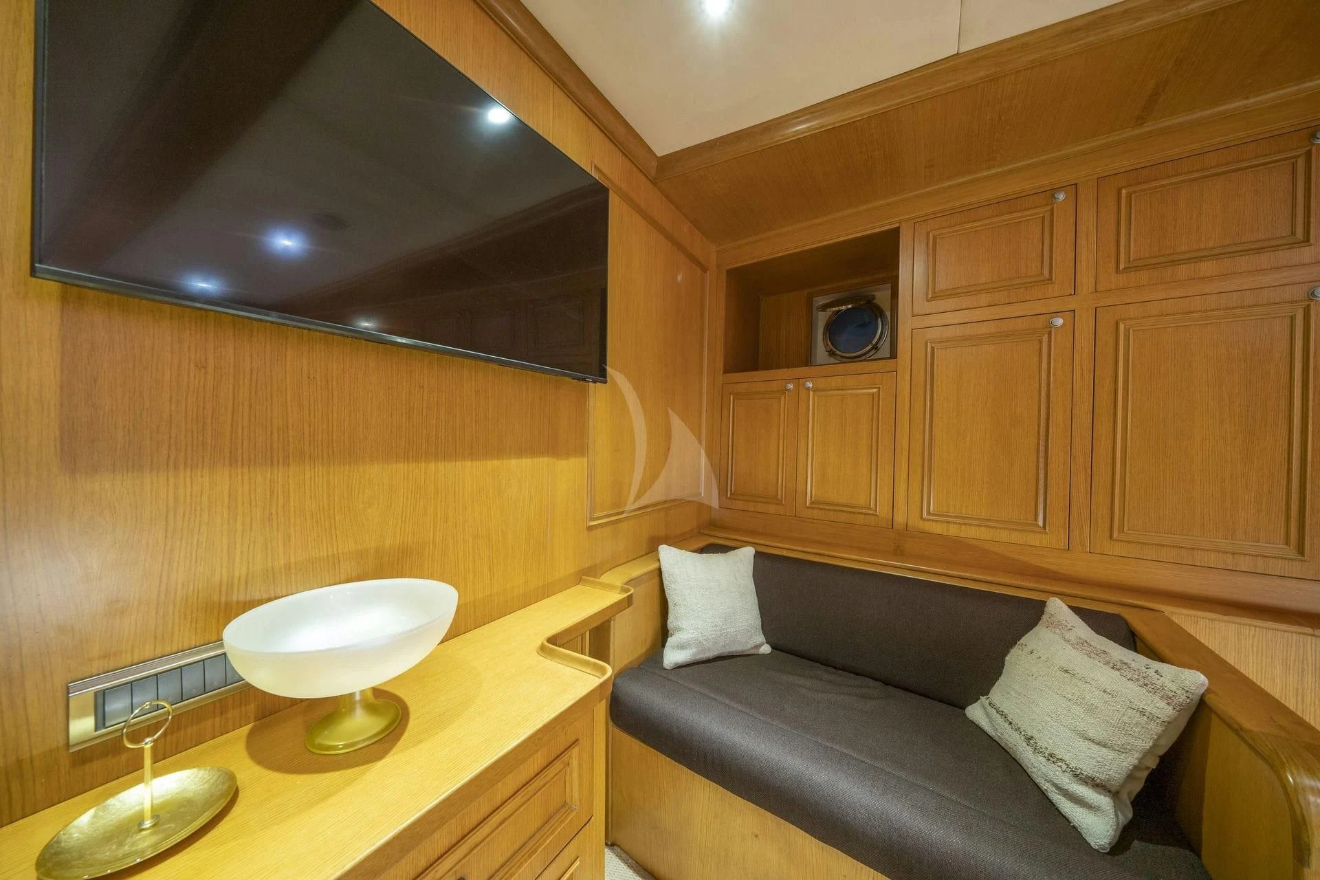 a room with a couch and a table aboard BABYLON Yacht for Sale