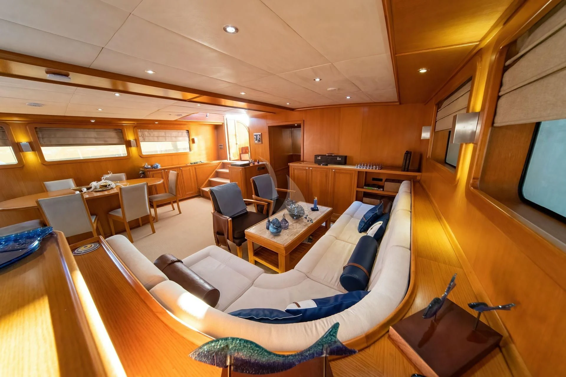 a room with a couch and a television aboard BABYLON Yacht for Sale