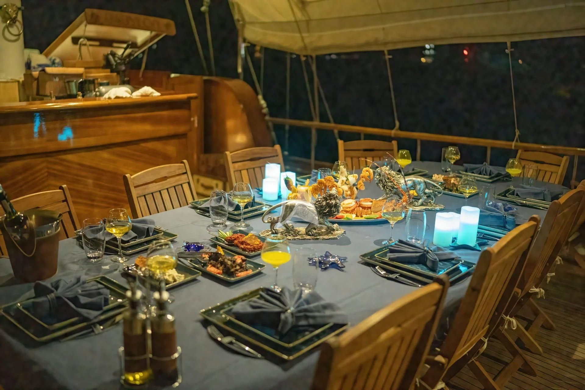 a table with plates and glasses aboard BABYLON Yacht for Sale
