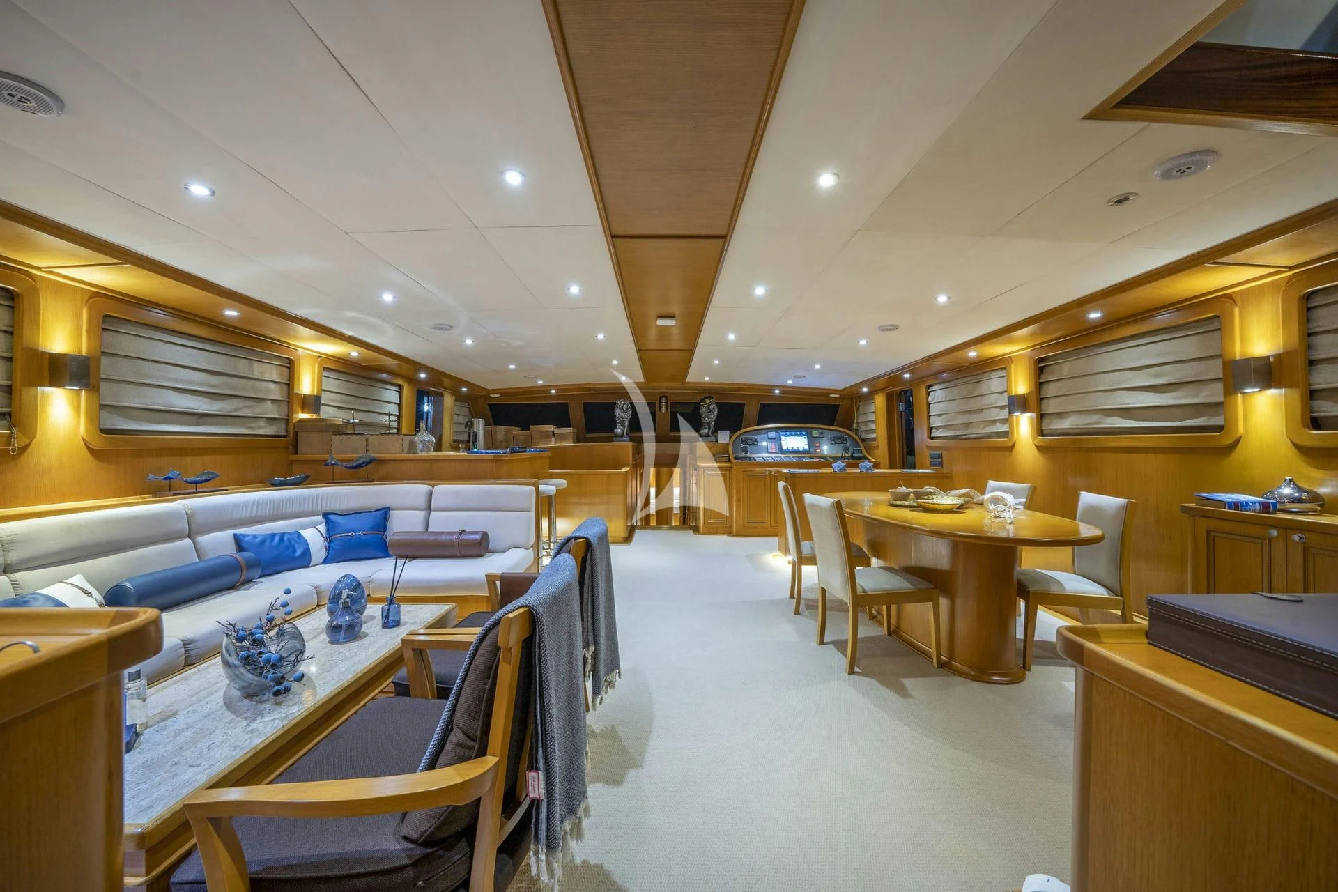 a room with tables and chairs aboard BABYLON Yacht for Sale