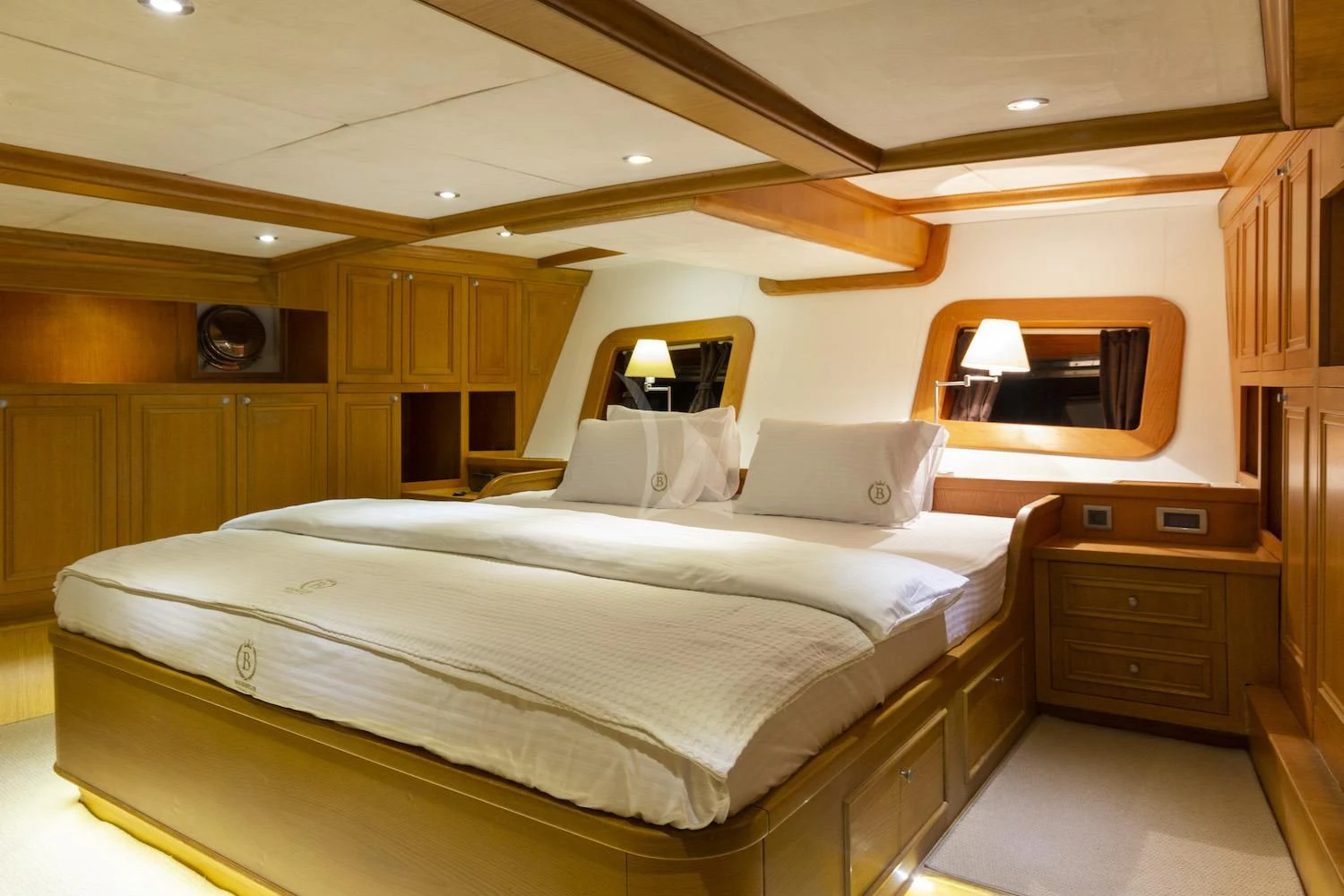 a room with a bed and a television aboard BABYLON Yacht for Sale
