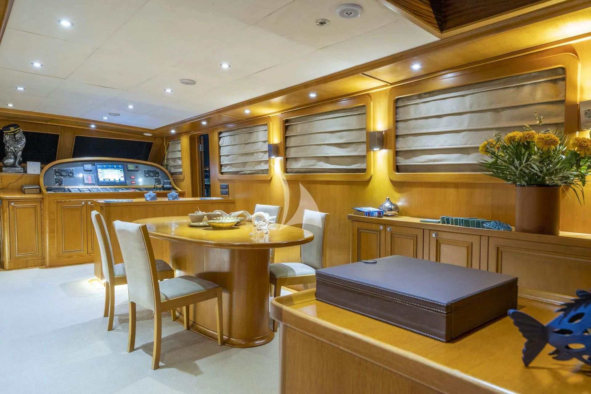 a room with a table and chairs aboard BABYLON Yacht for Sale