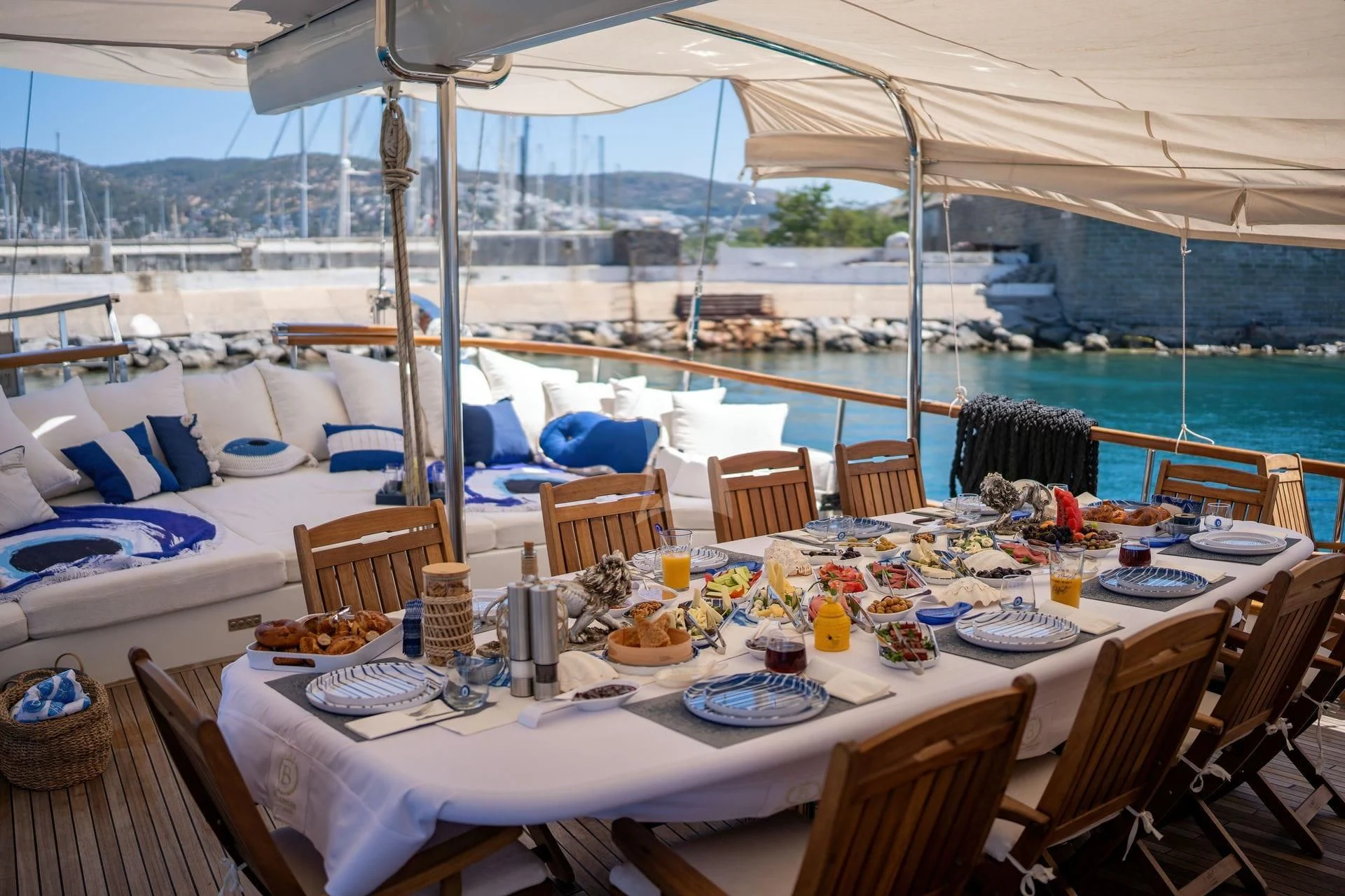 a table set for a meal on a boat aboard BABYLON Yacht for Sale