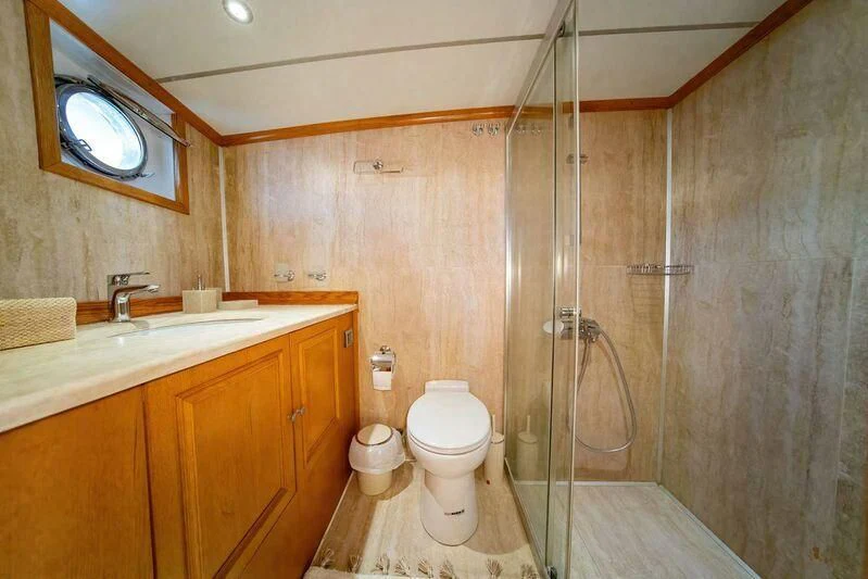 a bathroom with a shower and toilet aboard BABYLON Yacht for Sale