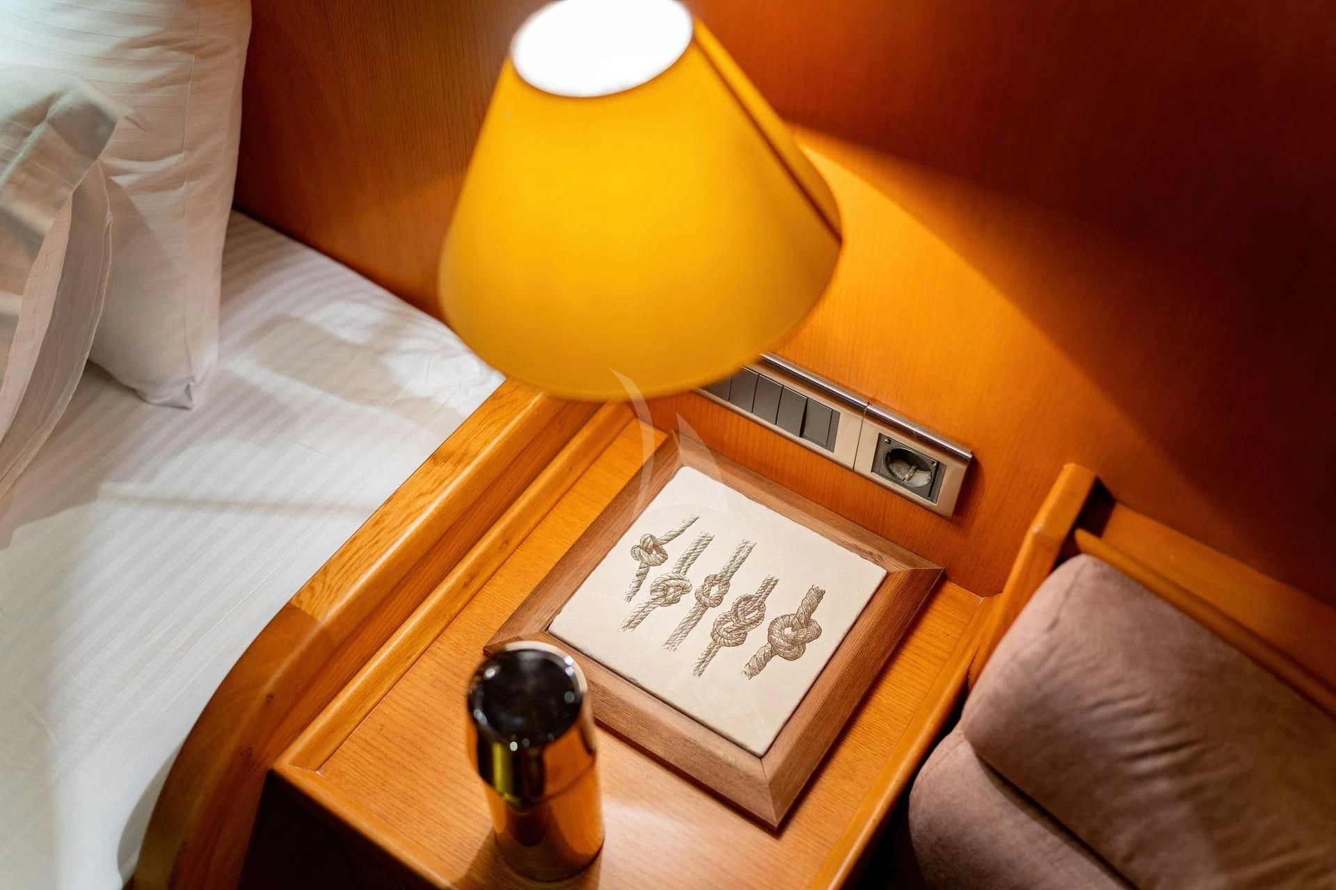 a lamp on a table aboard BABYLON Yacht for Sale