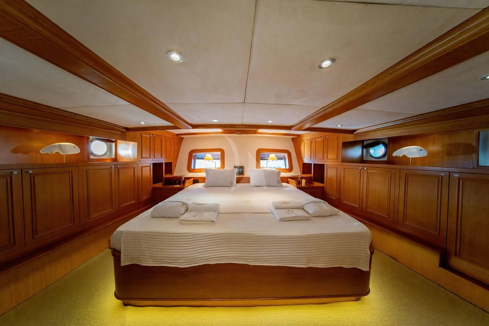 a room with a bed and a window aboard BABYLON Yacht for Sale