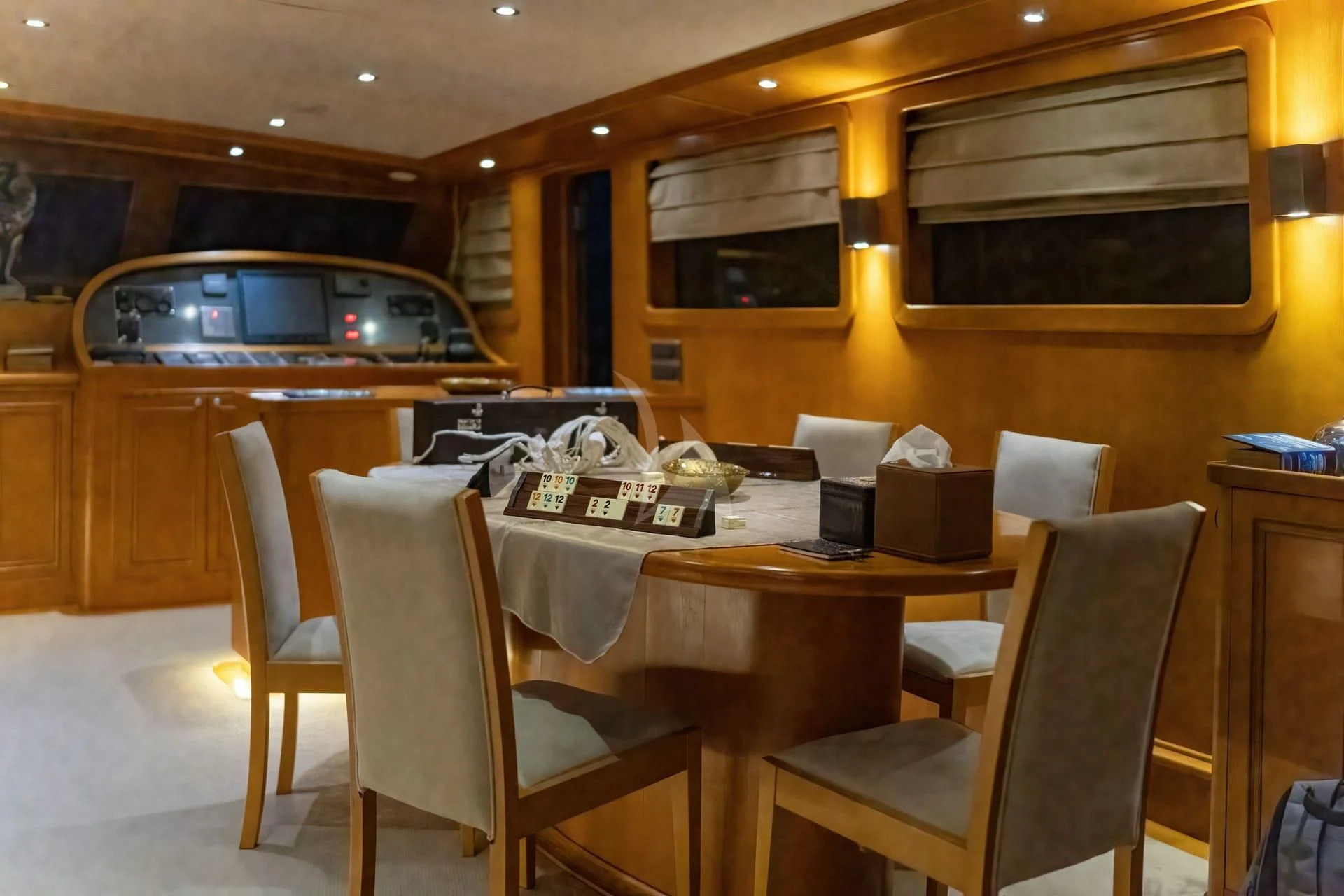 a table with chairs around it aboard BABYLON Yacht for Sale