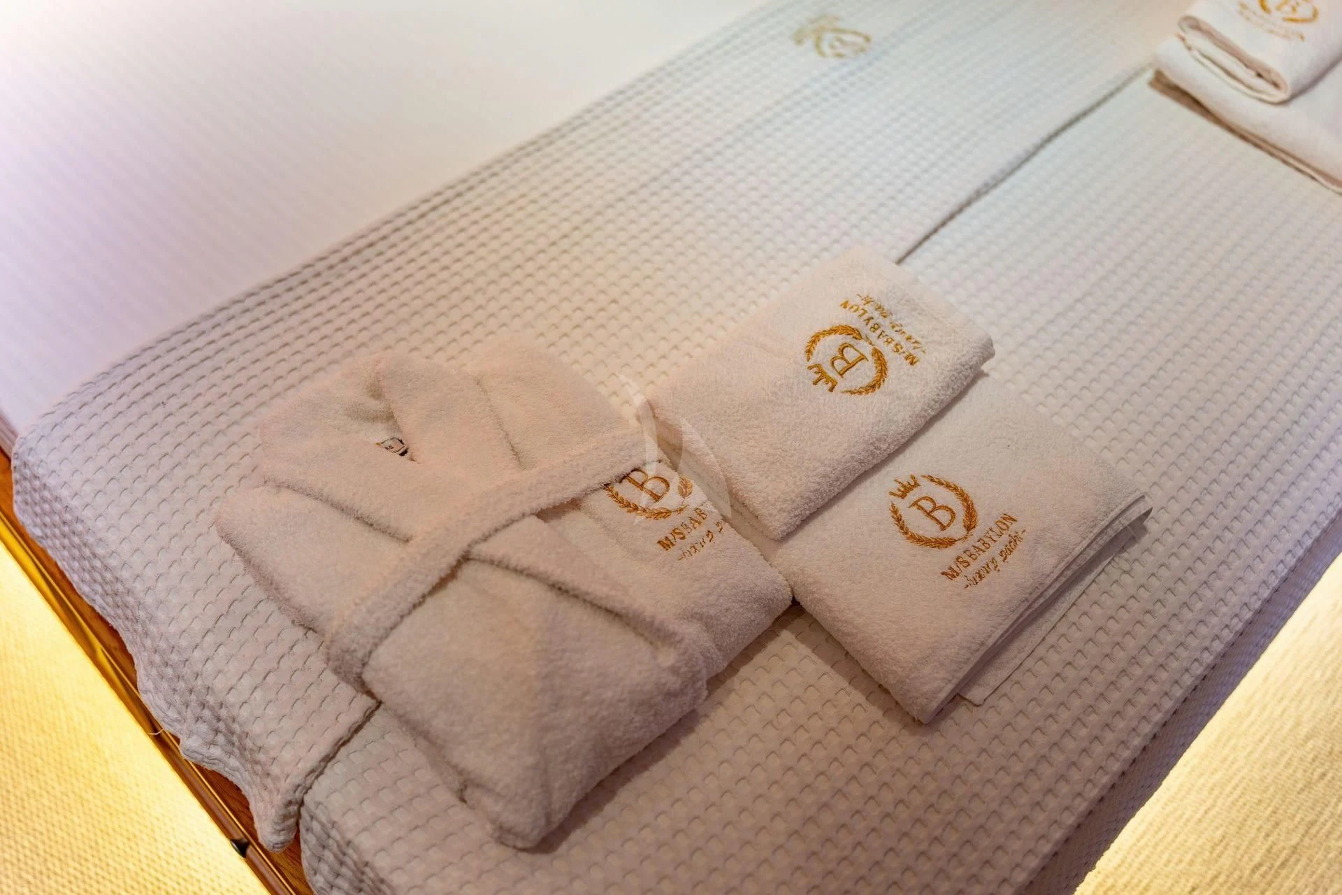 folded towels on a bed aboard BABYLON Yacht for Sale