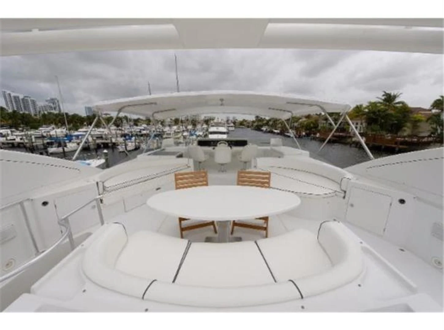 a large white building with a table and chairs on the roof aboard UTOPIA Yacht for Sale