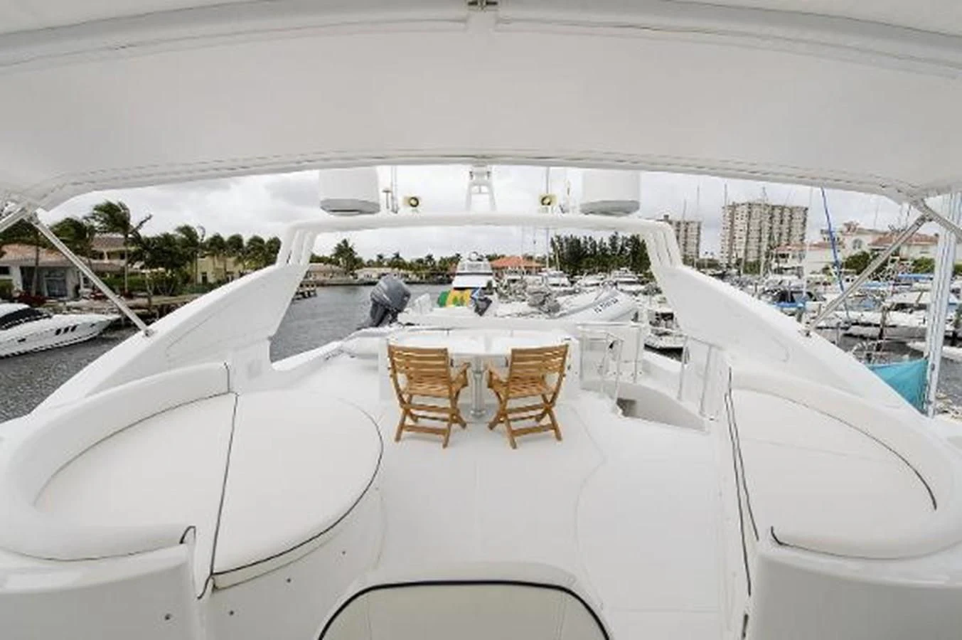 a white table with chairs on it aboard UTOPIA Yacht for Sale