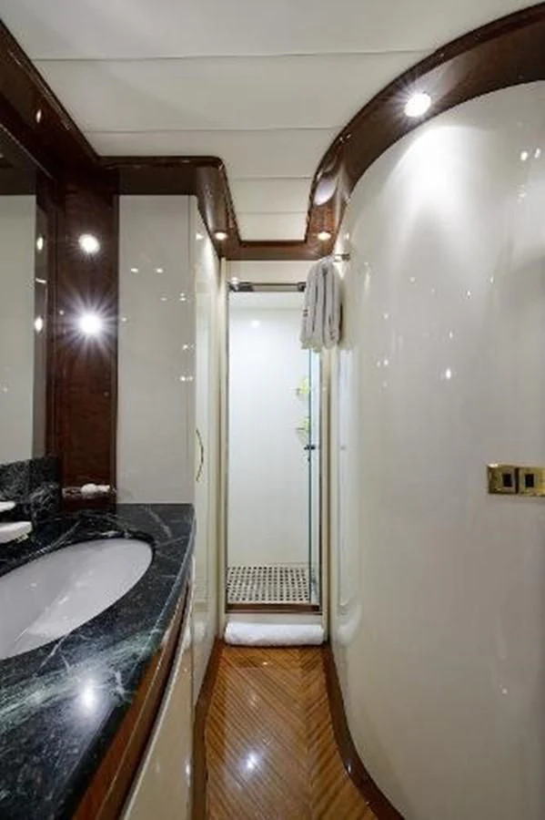 a bathroom with a sink and a mirror aboard UTOPIA Yacht for Sale