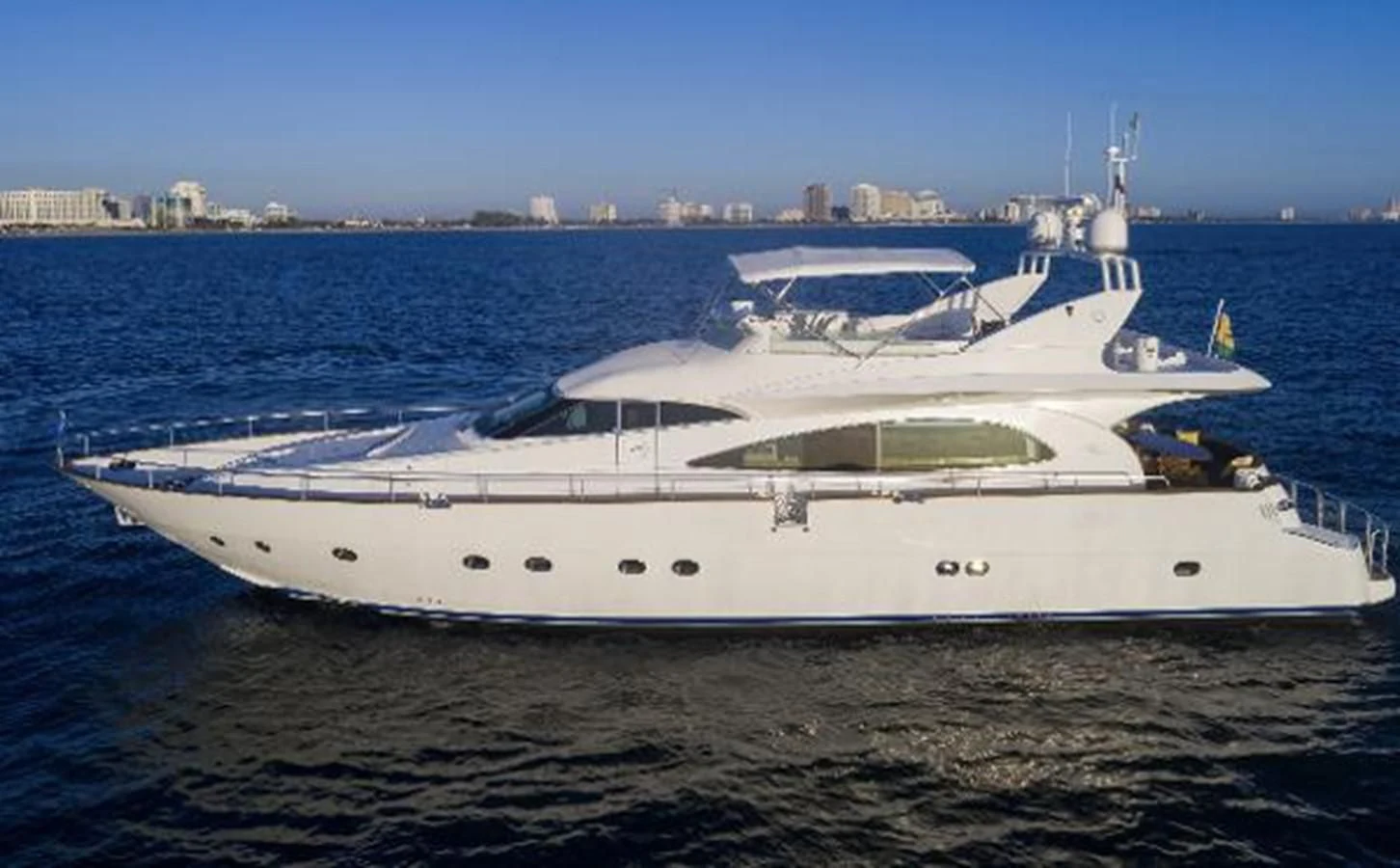 a white yacht on the water aboard UTOPIA Yacht for Sale