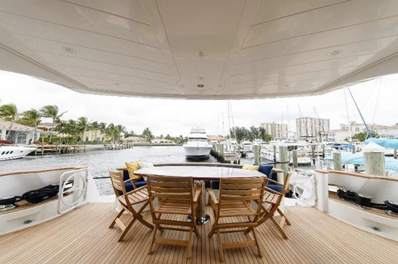 a table and chairs on a deck aboard UTOPIA Yacht for Sale