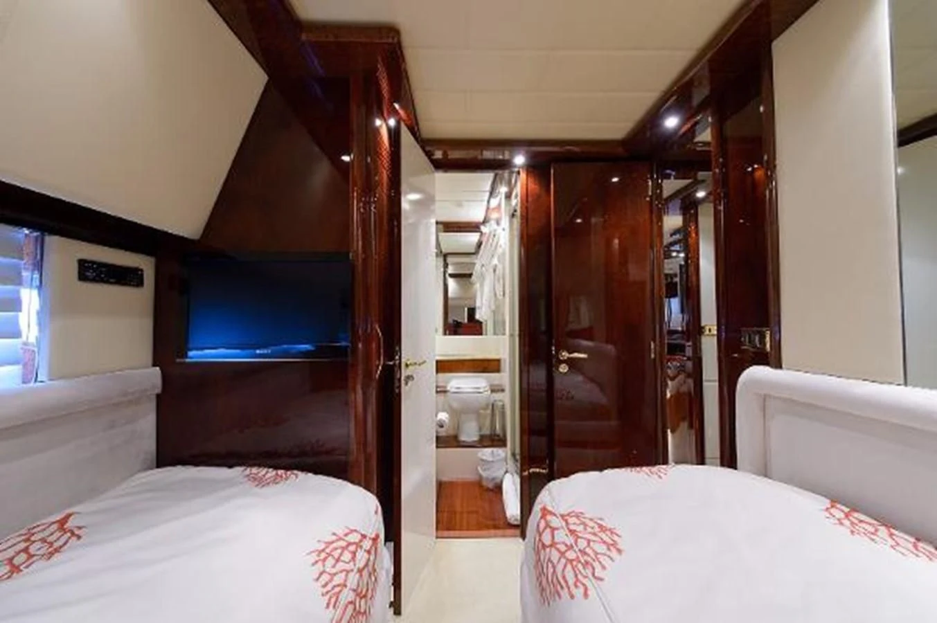 a room with a bed and a closet aboard UTOPIA Yacht for Sale