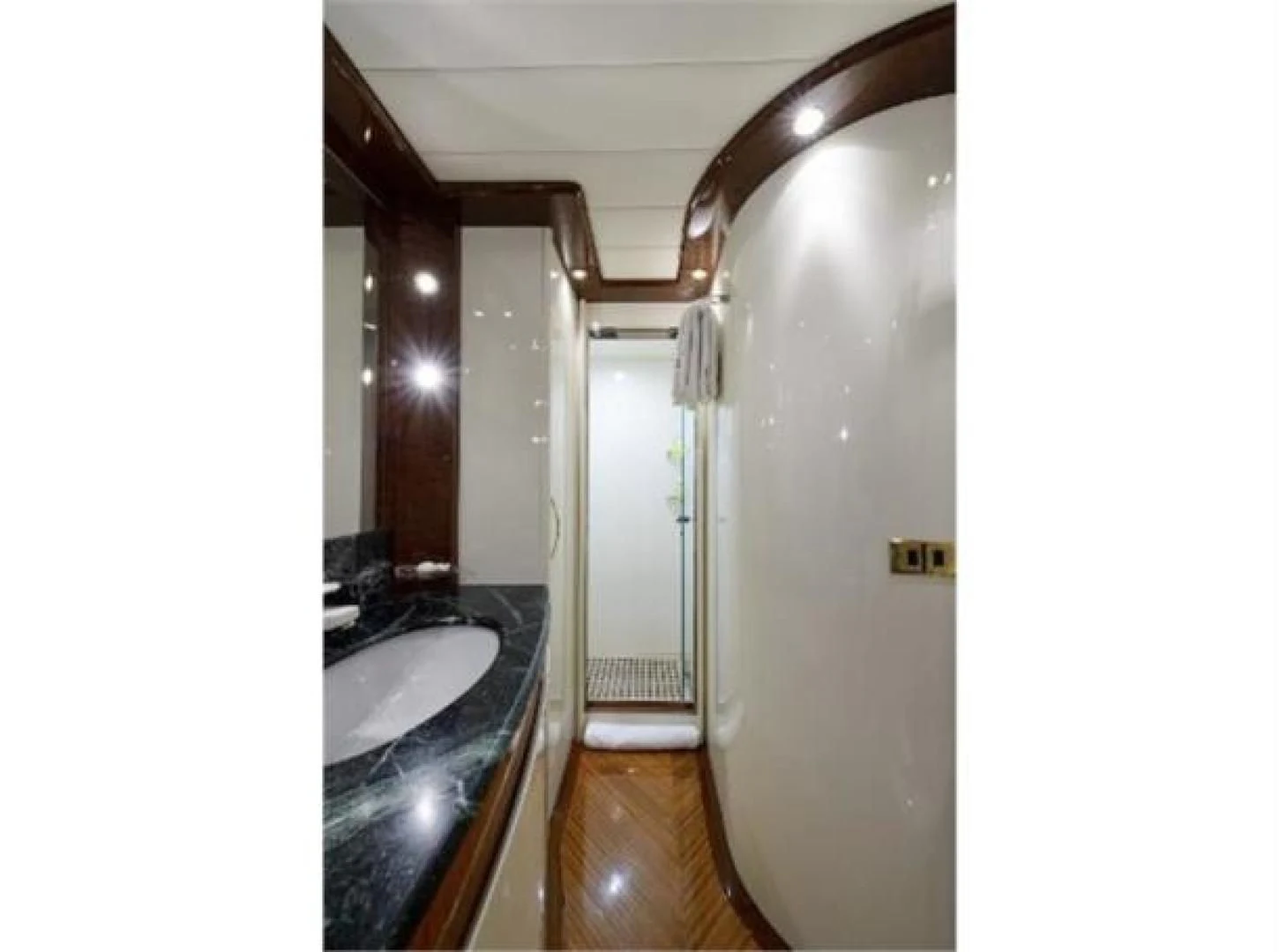 a bathroom with a sink and a mirror aboard UTOPIA Yacht for Sale