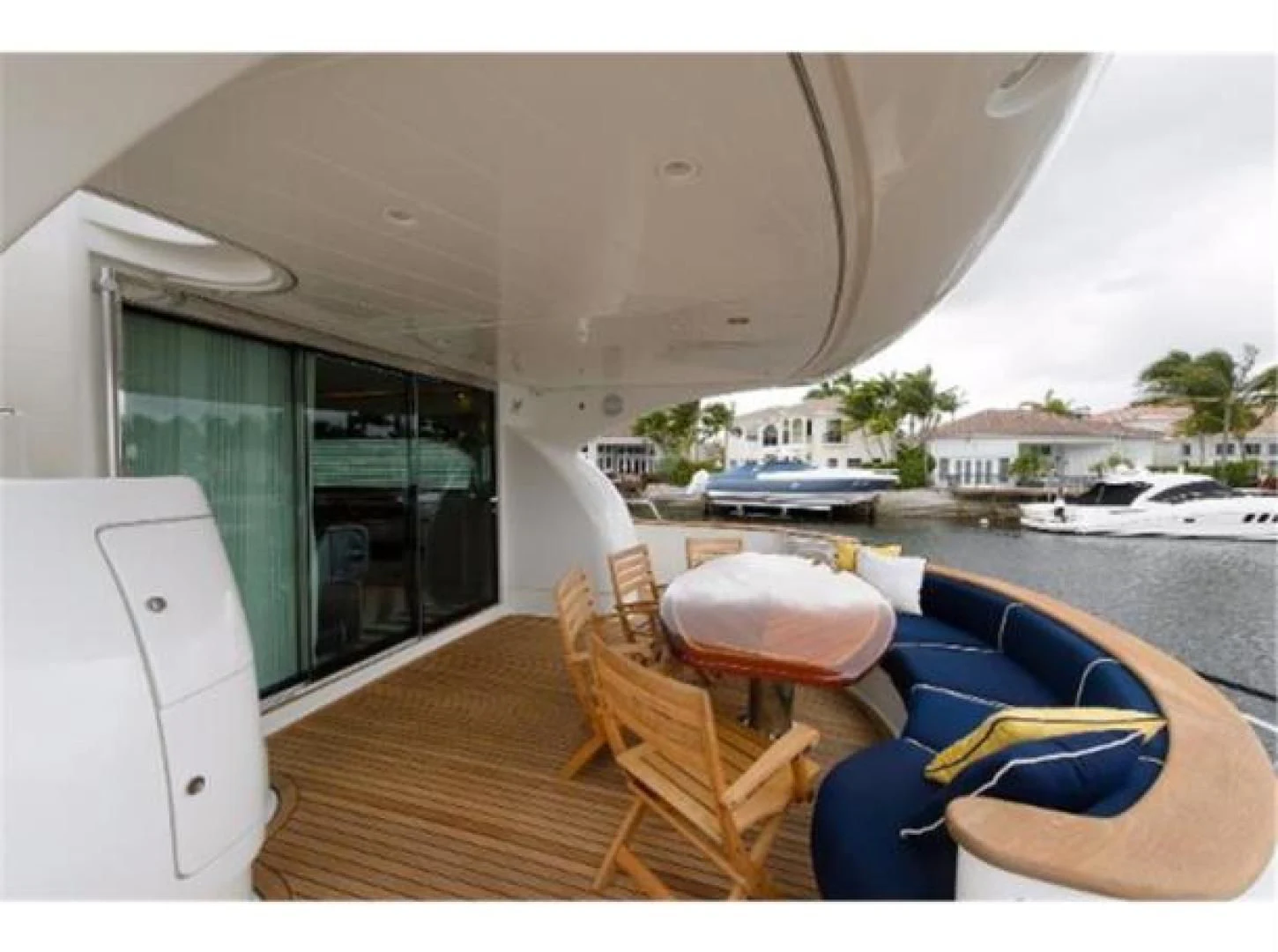 a deck with chairs and a table aboard UTOPIA Yacht for Sale