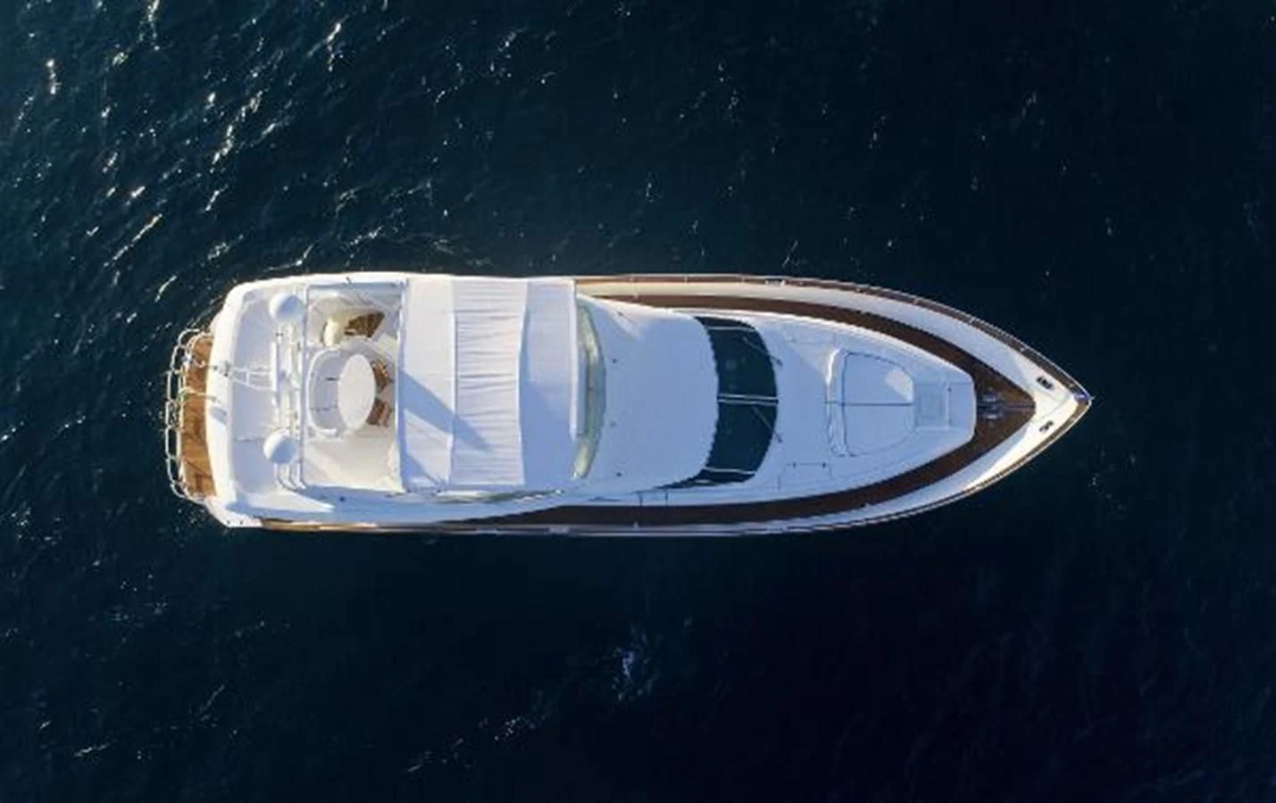 a white object with a hole in it in the middle of water aboard UTOPIA Yacht for Sale