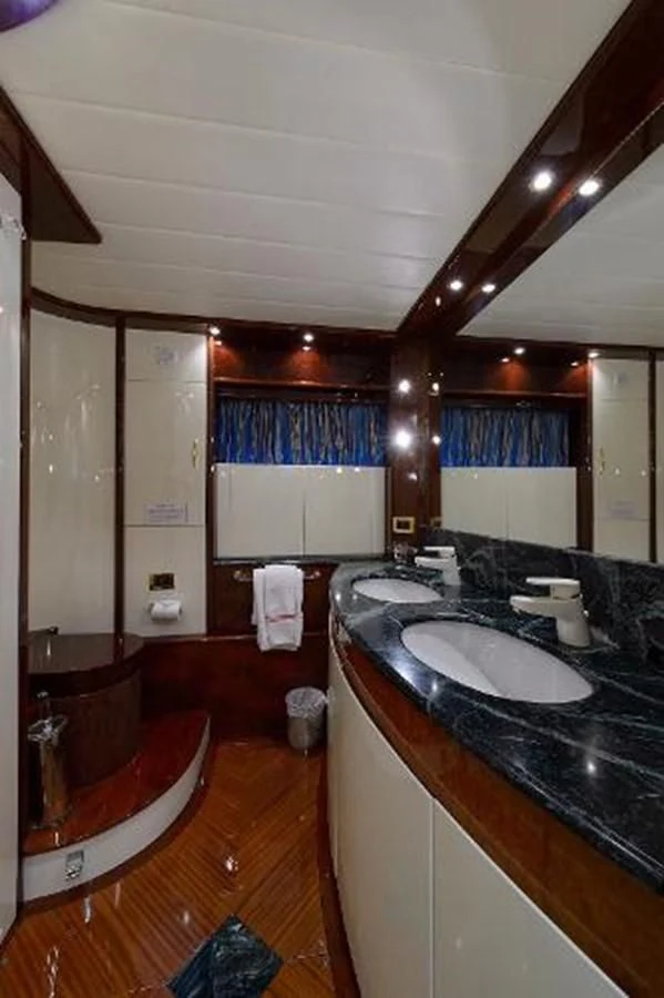 a bathroom with a sink and a bathtub aboard UTOPIA Yacht for Sale