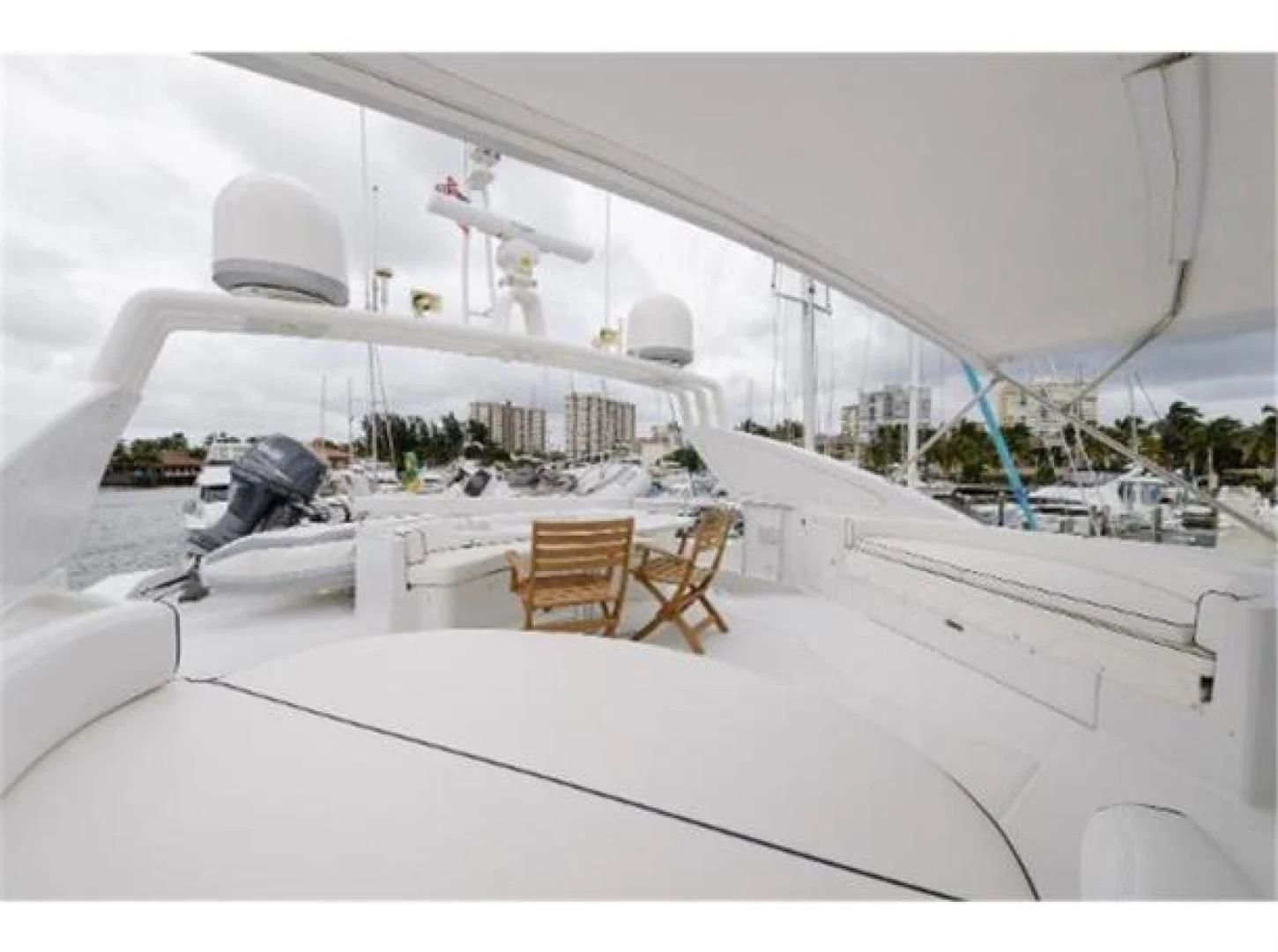 a white boat with chairs on it aboard UTOPIA Yacht for Sale