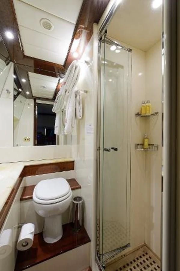 a bathroom with a toilet and a sink aboard UTOPIA Yacht for Sale